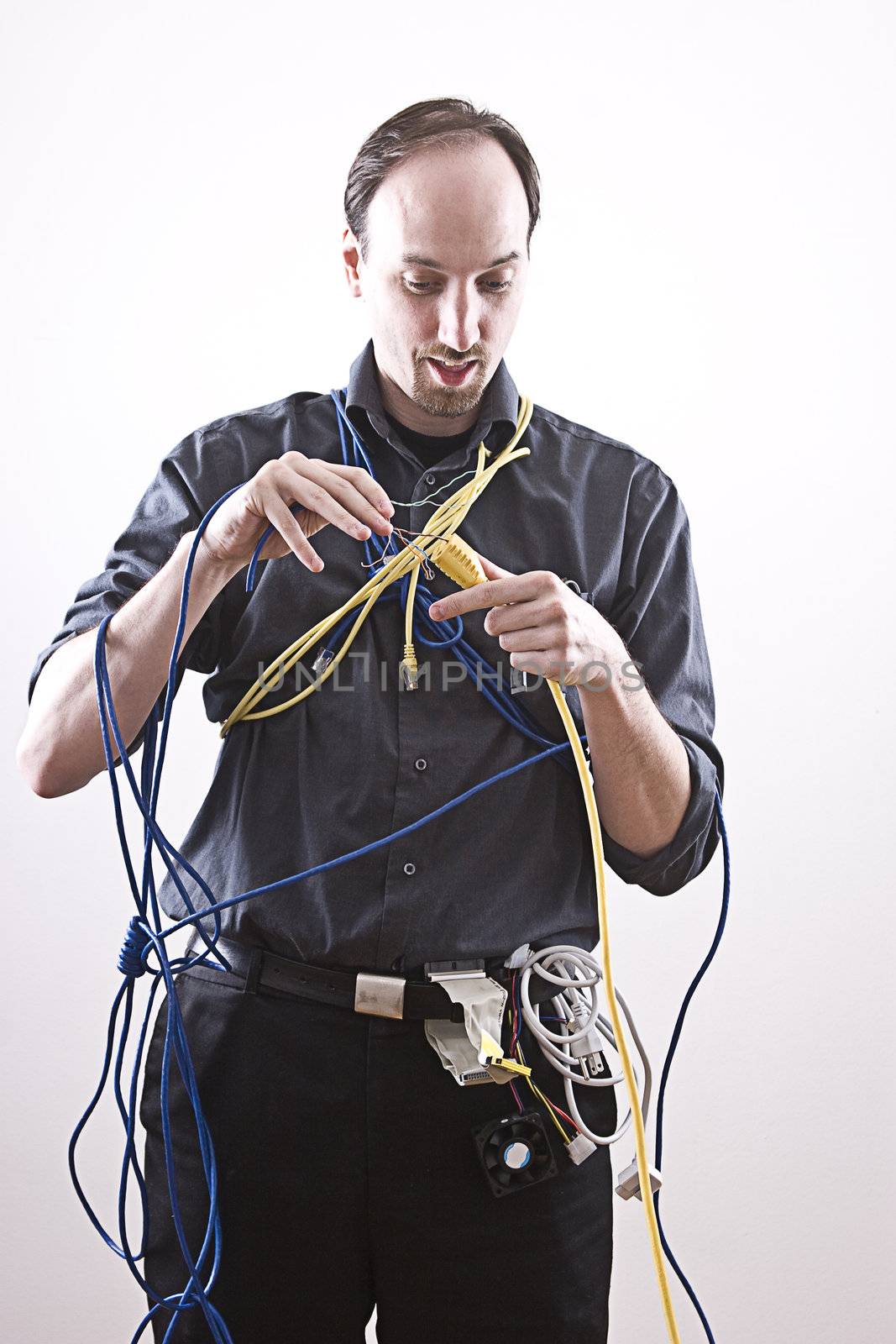 Electronic technician doing a very dangerous connection