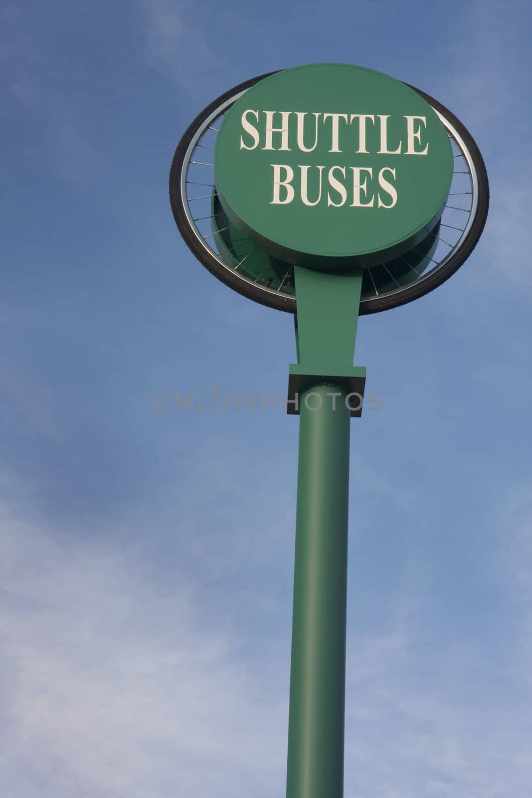 shuttle buses sign against blue sky by PixelsAway
