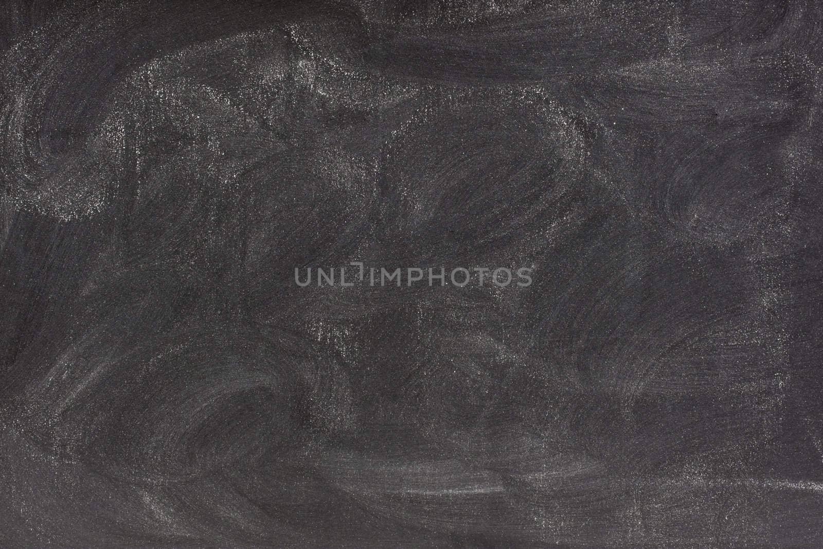 blank chalkboard with eraser smudges by PixelsAway