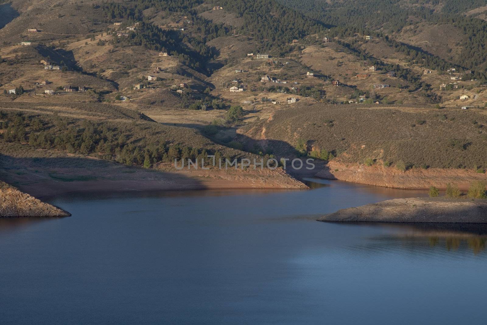 residential luxury houses on hills above Horsetooth Reservoir near Fort Collins in northern Colorado, early morning fall scenery