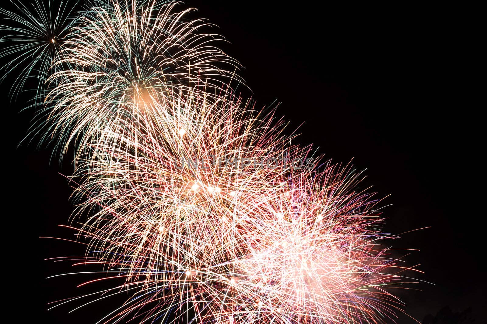 Firework display against black sky