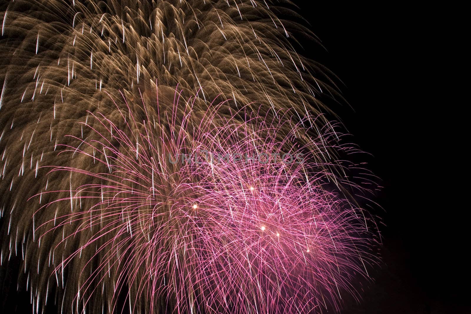 Firework display against black sky