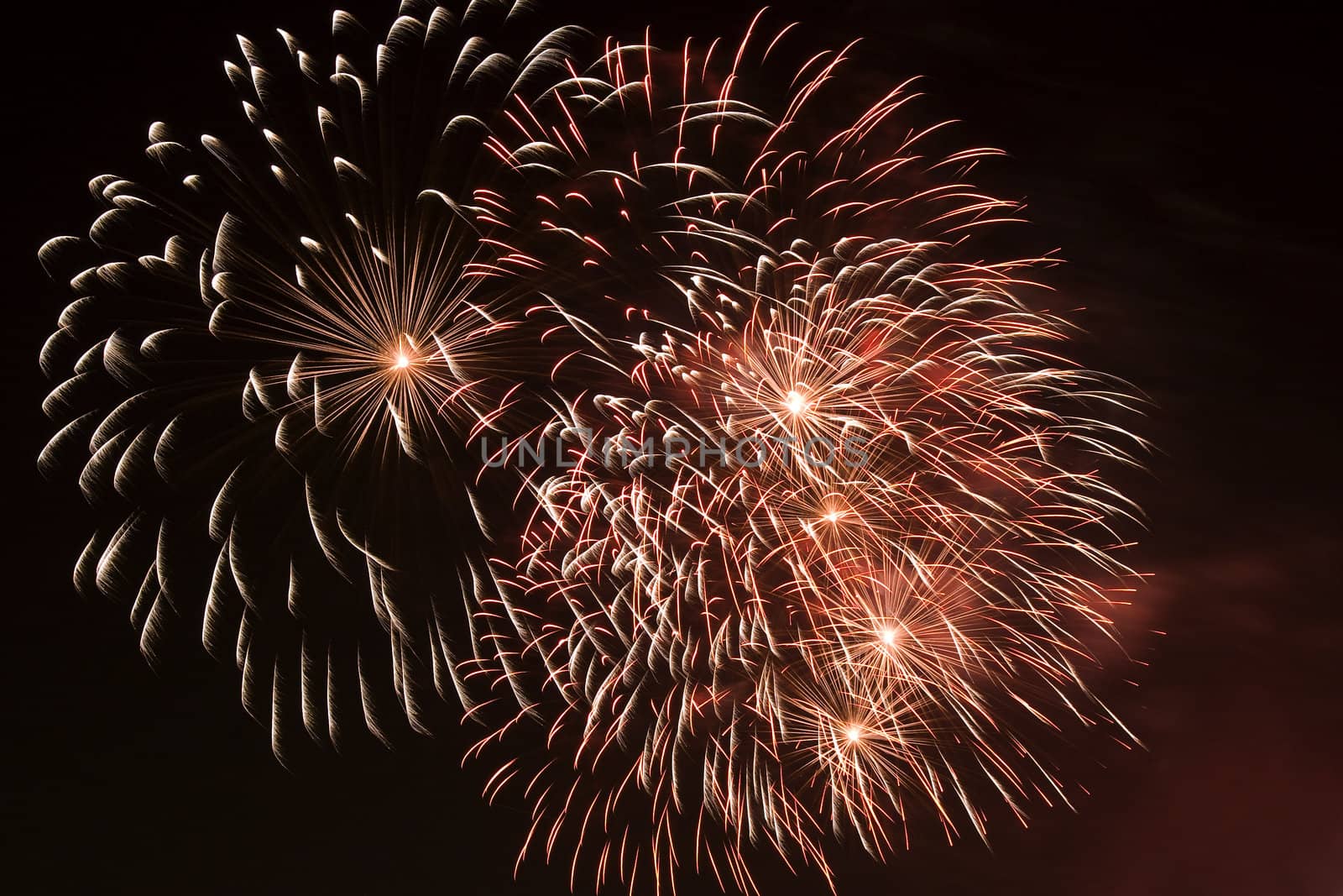 Firework display against black sky