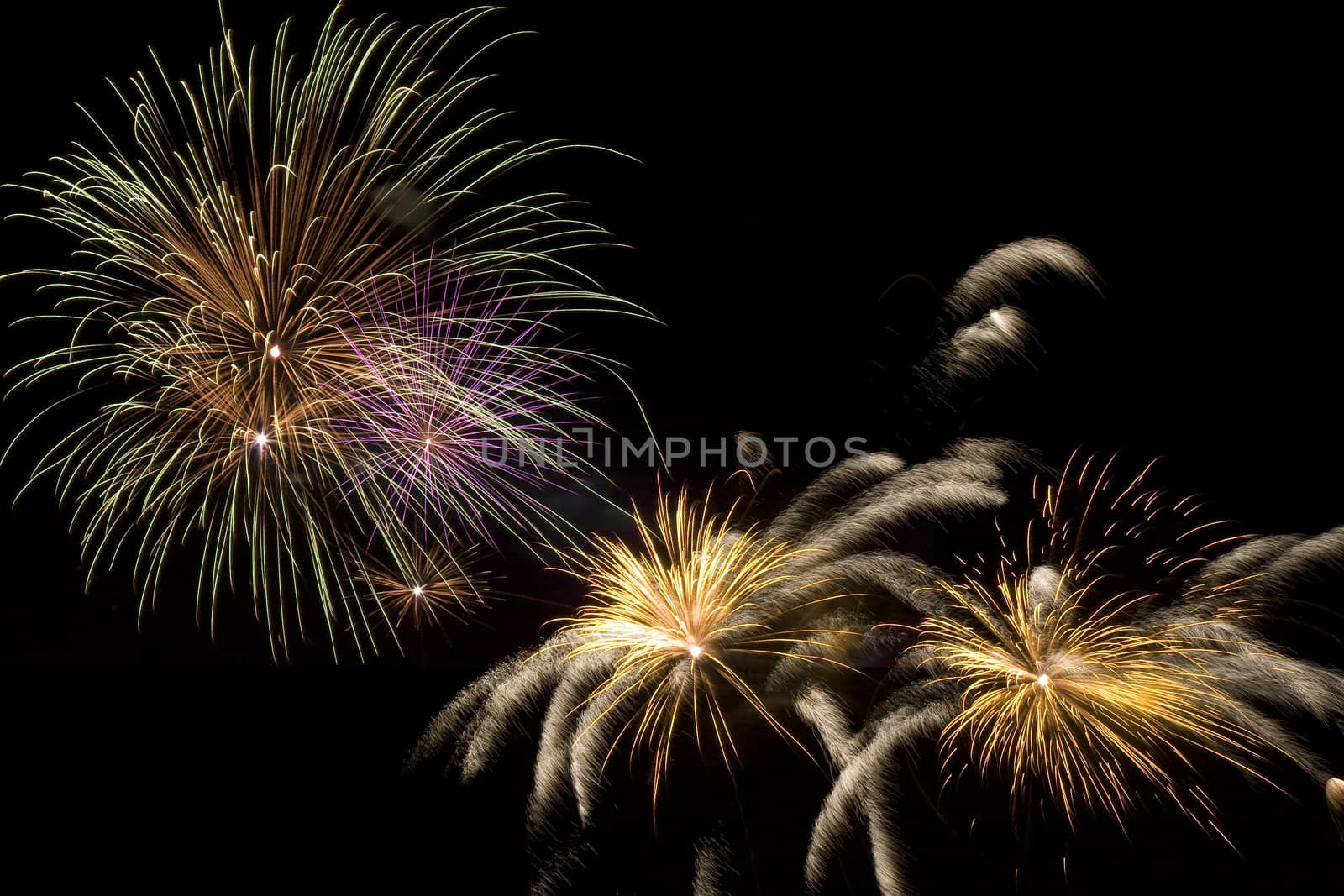 Firework display against black sky