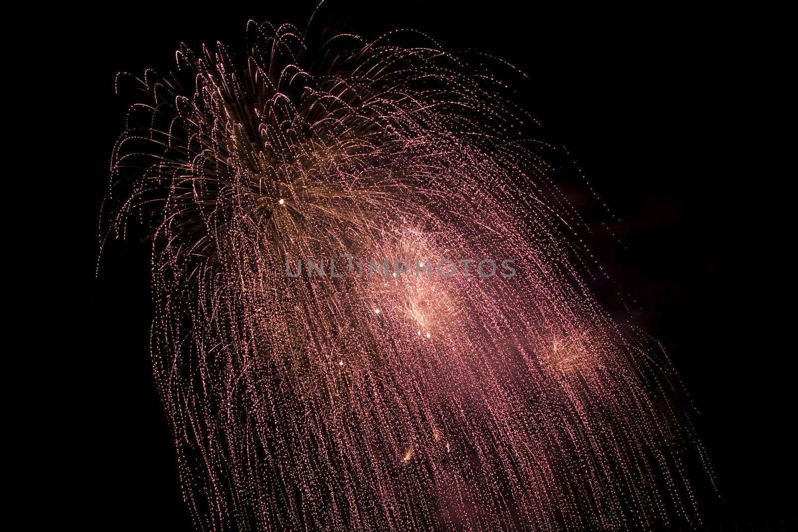 Firework display against black sky