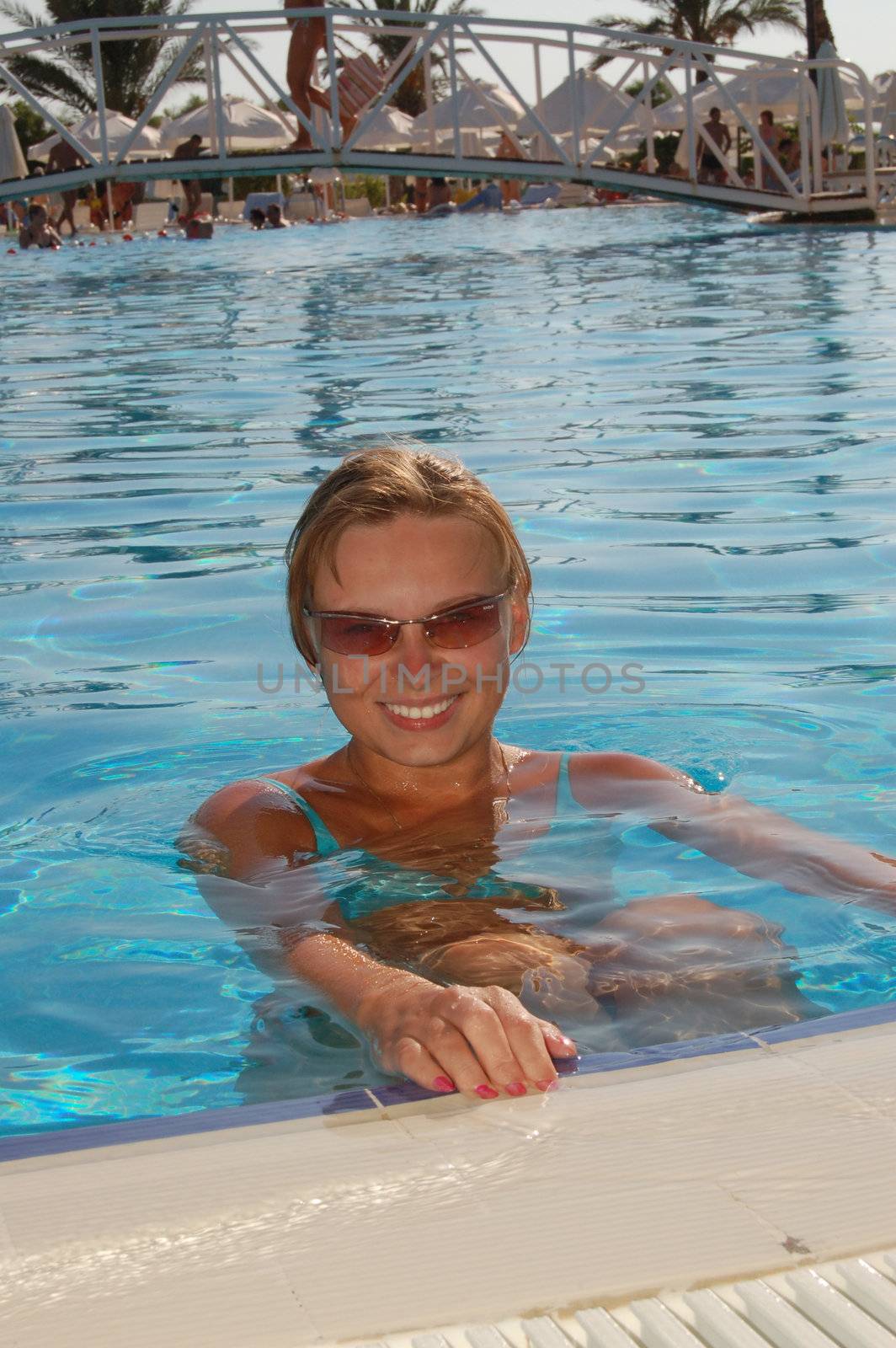 Beautiful woman in a swimming pool.