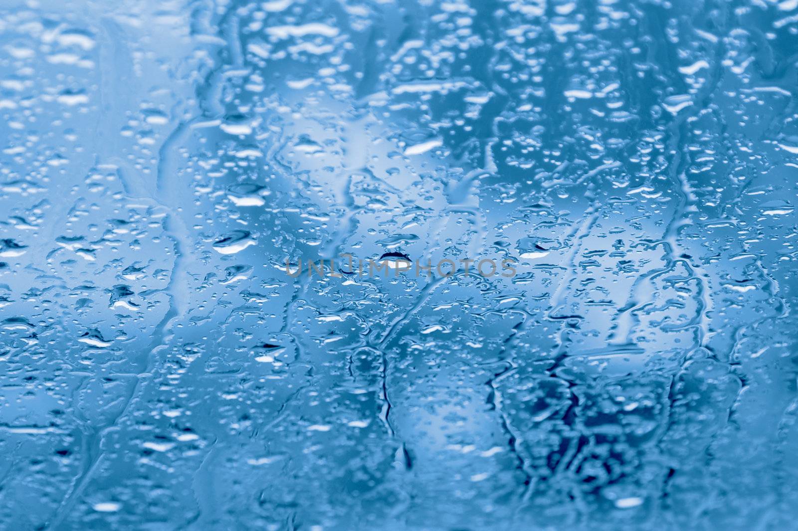  Rain drops on a window of car