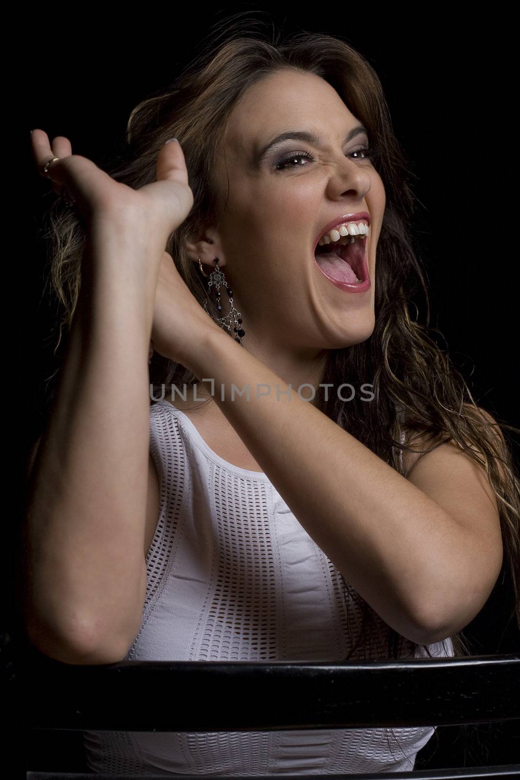 Young women, in her twenties, with her hand stuck in her hair and trying to pull it out