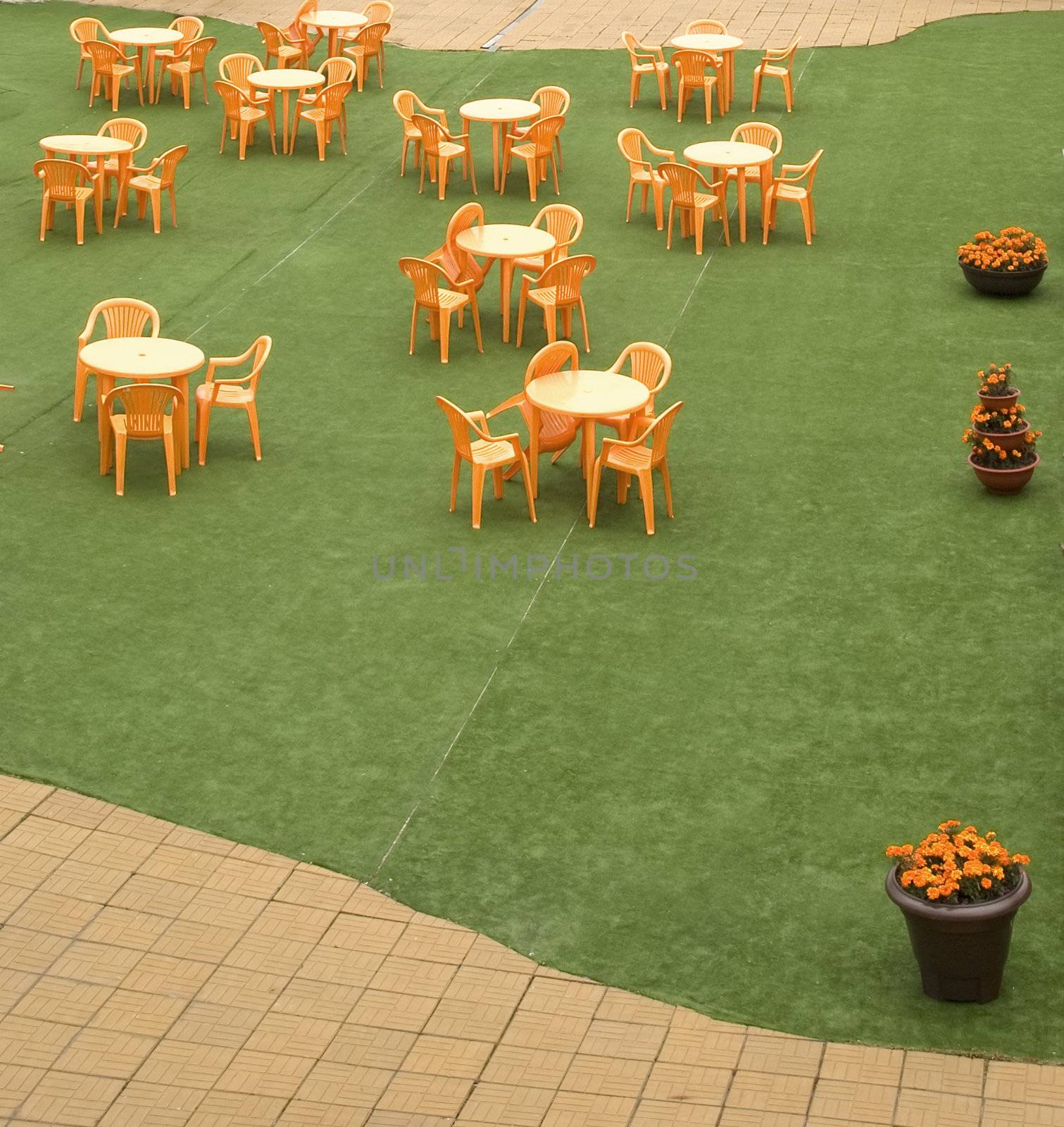 Tables and beautiful chairs in empty open air cafe