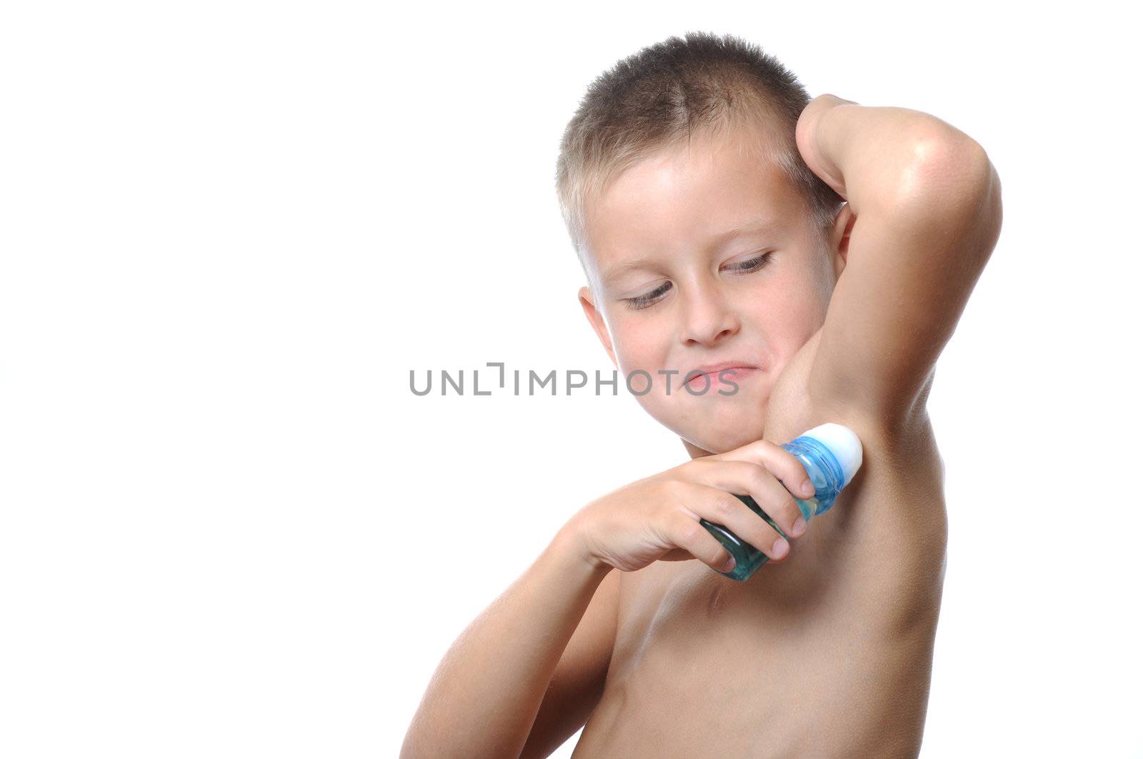 handsome young man applying deodorant and fun like a adult