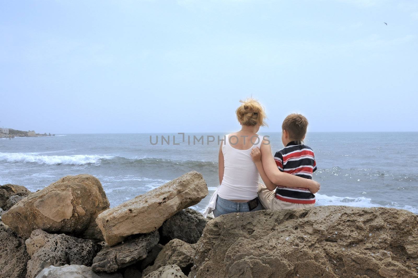 Family on the beach caribbean sea. ma and son.