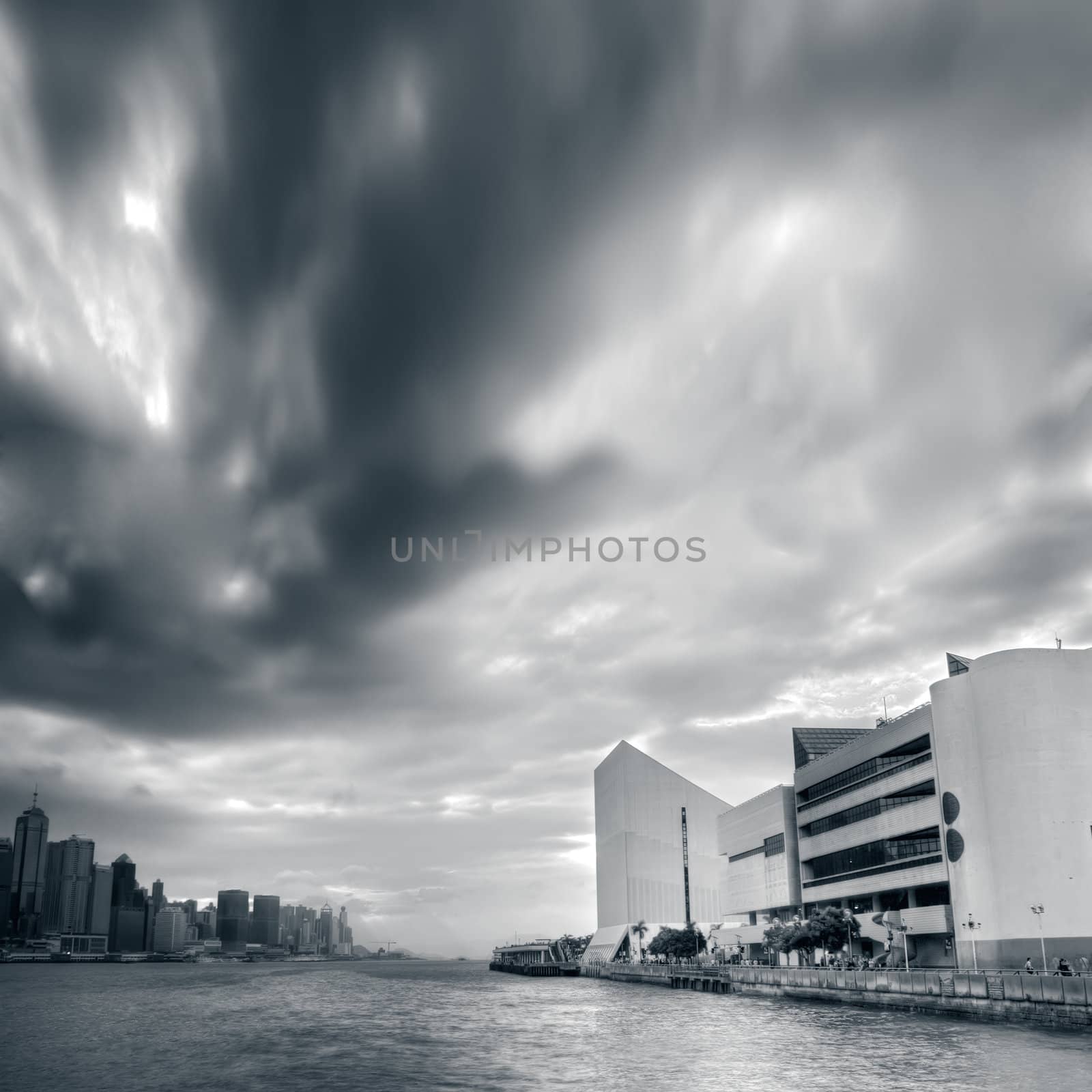 Cityscape of dramatic clouds motion near the bay in Hong Kkong.