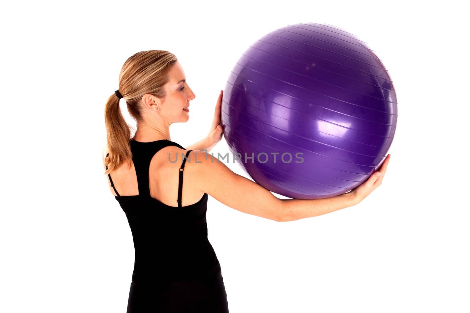 Young woman doing yoga ball exercises isoalted