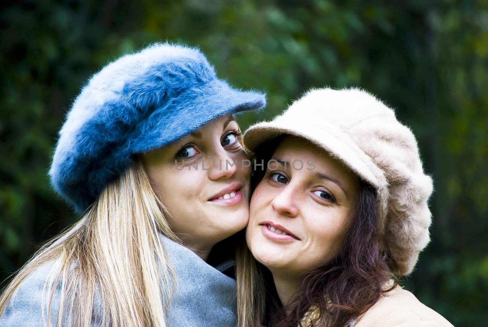 two cute girls having fun outdoors in autumn