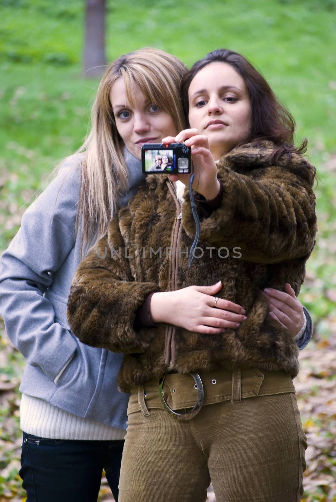 cute girls making photo session in autumn