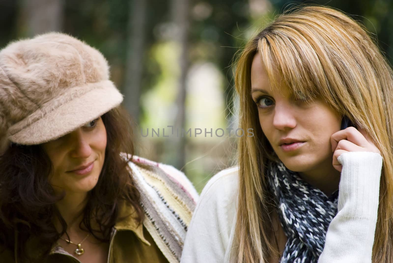 two cute smiling women outdoors in autumn