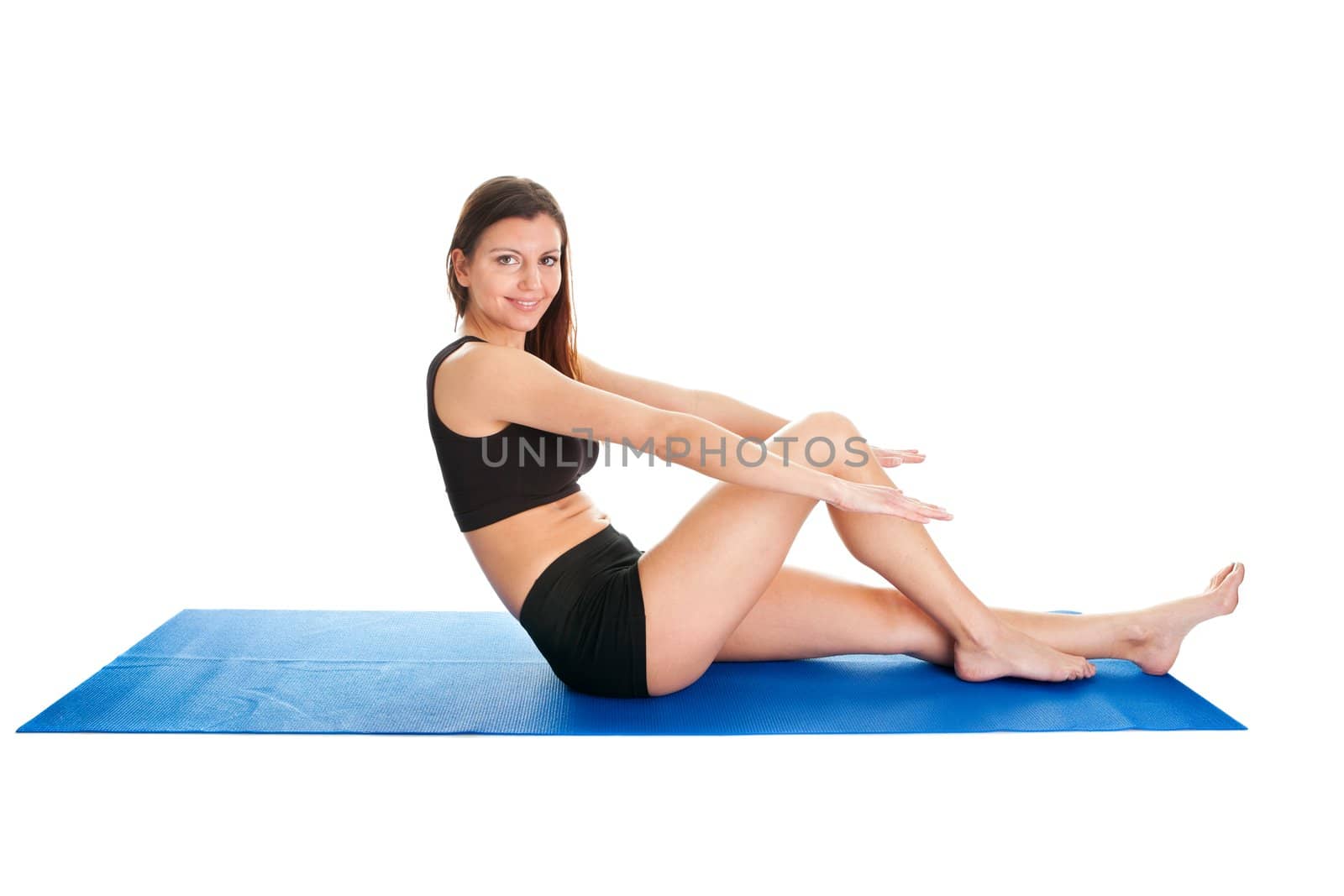 Fitness woman doing aerobics on gym mat. Isolated on white