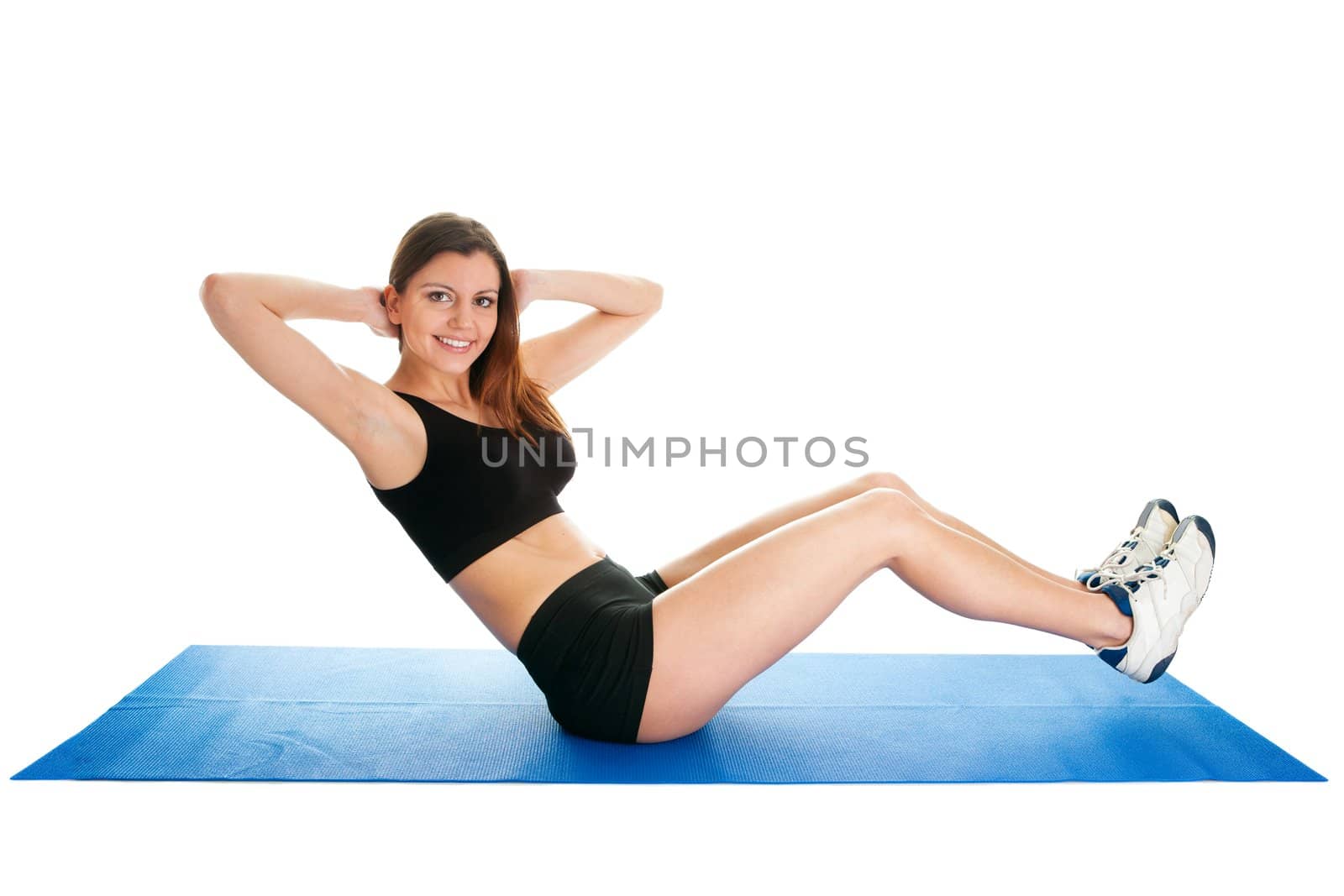 Fitness woman doing aerobics on gym mat. Isolated on white