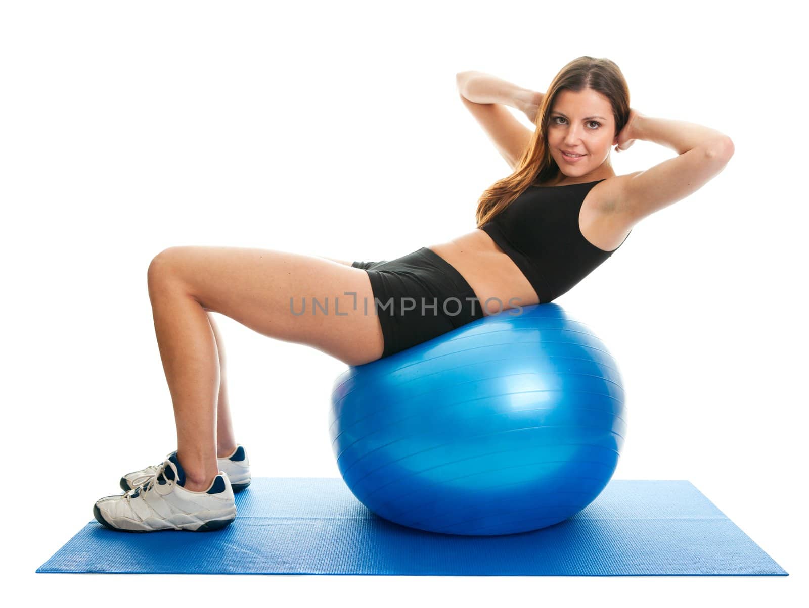 Fitness woman doing crunches on gym mat. Isolated on white
