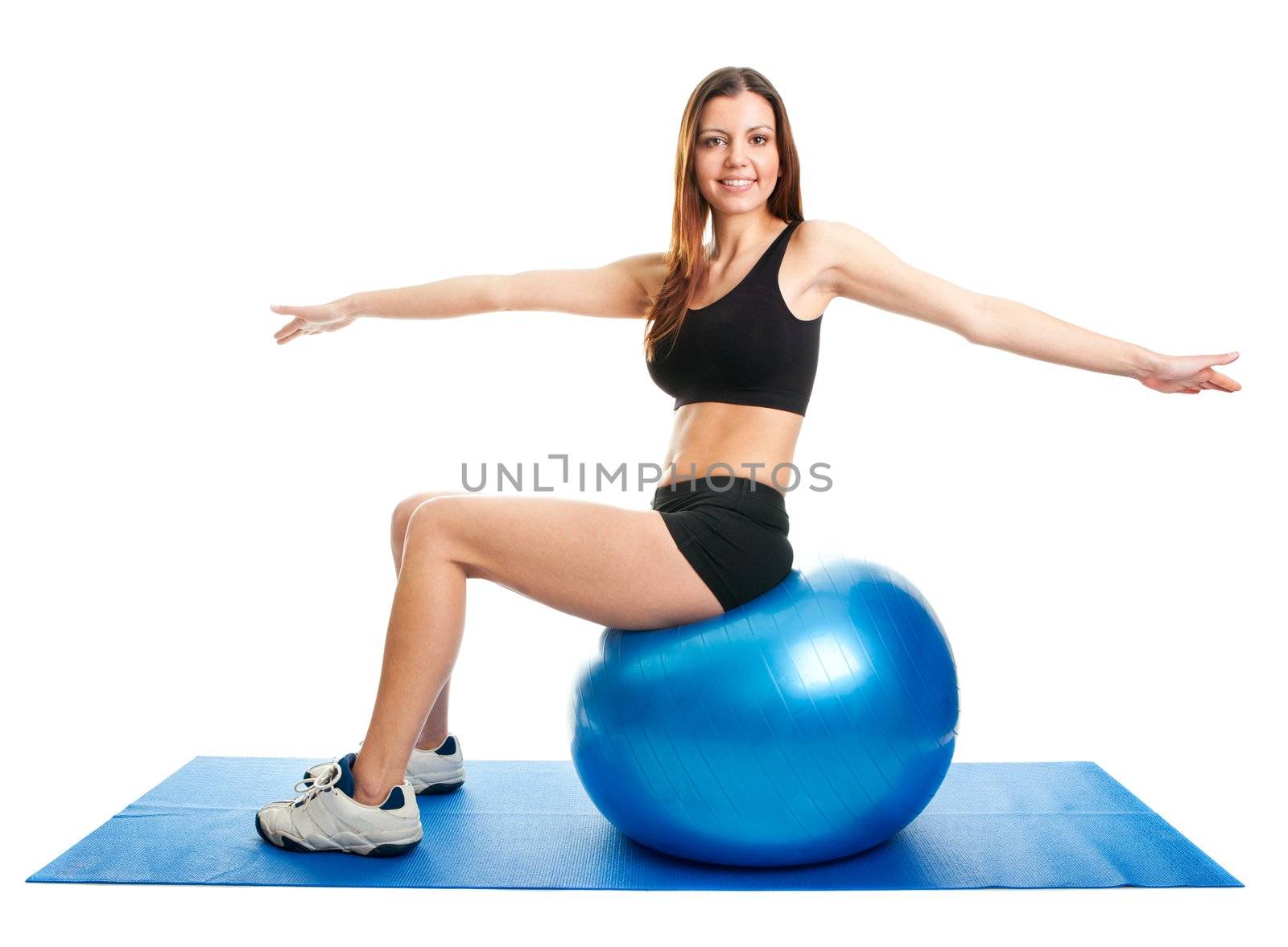 Fitness woman stretshing on fitness ball. Isolated on white