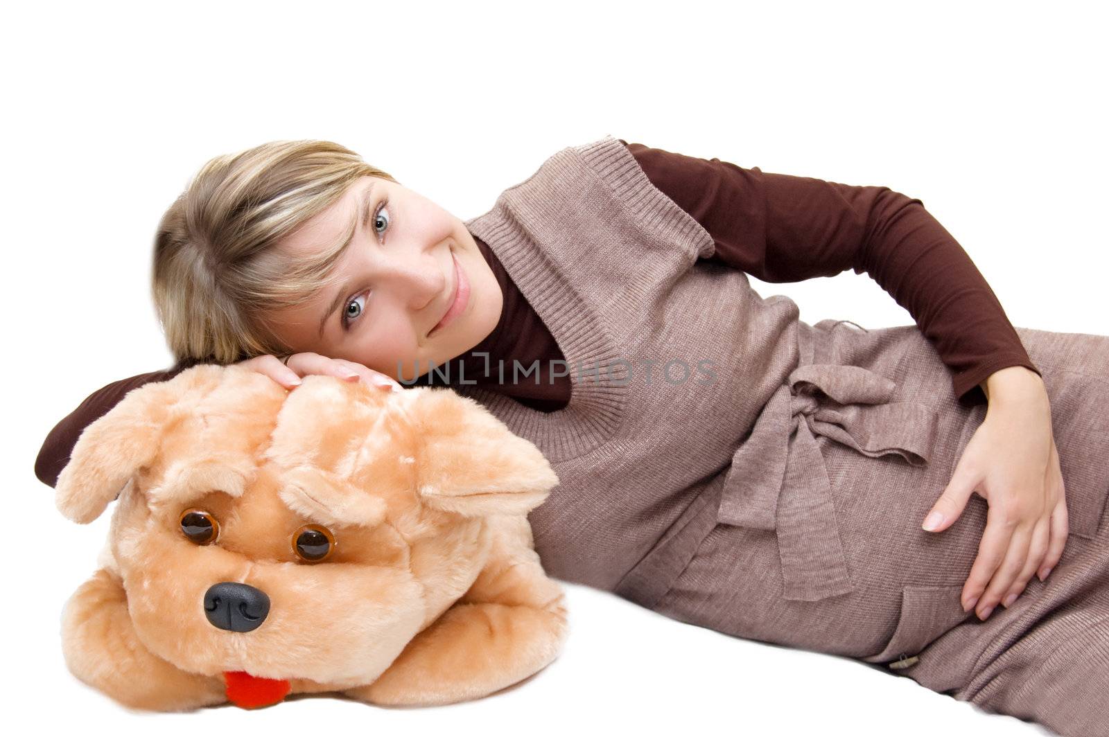 Smiling pregnant and big toy dog over white