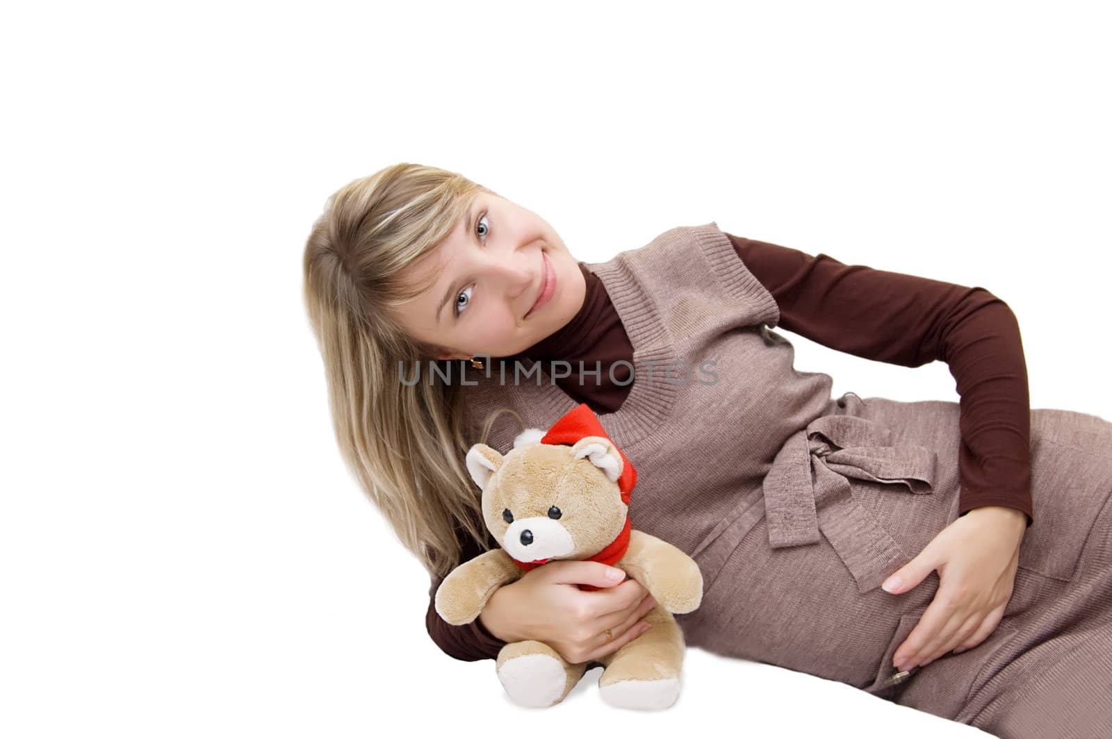 Smiling pregnant with bear isolated on white
