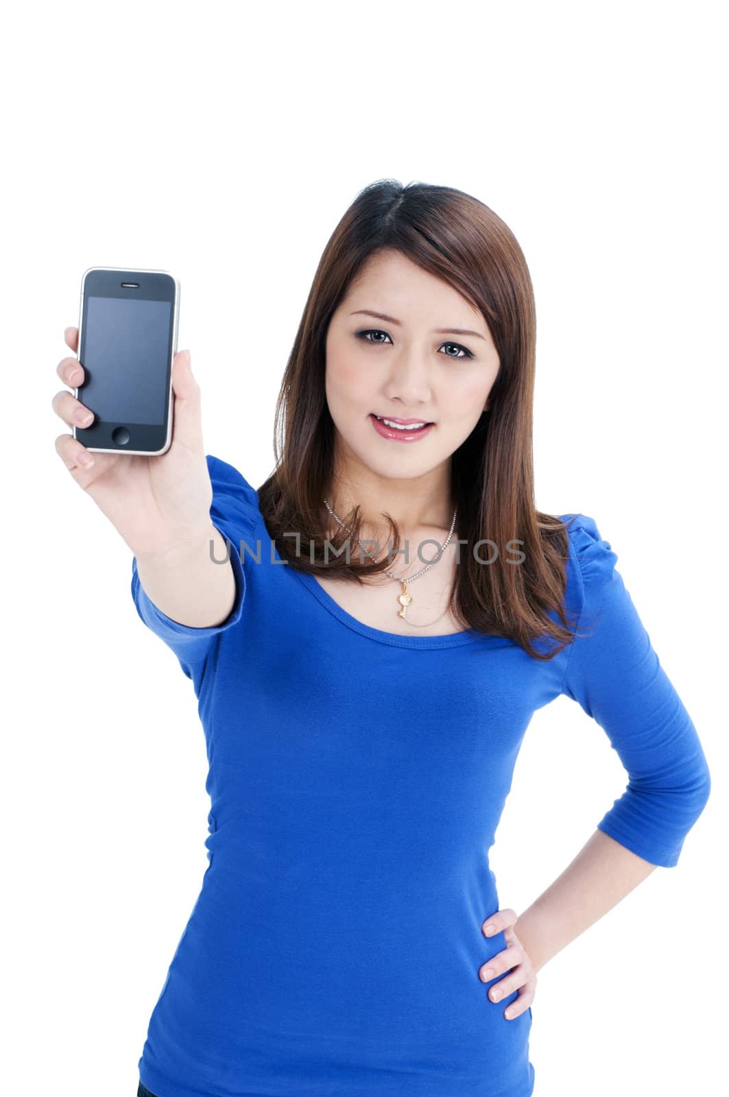 Portrait of a cute young woman holding a cellphone over white background.