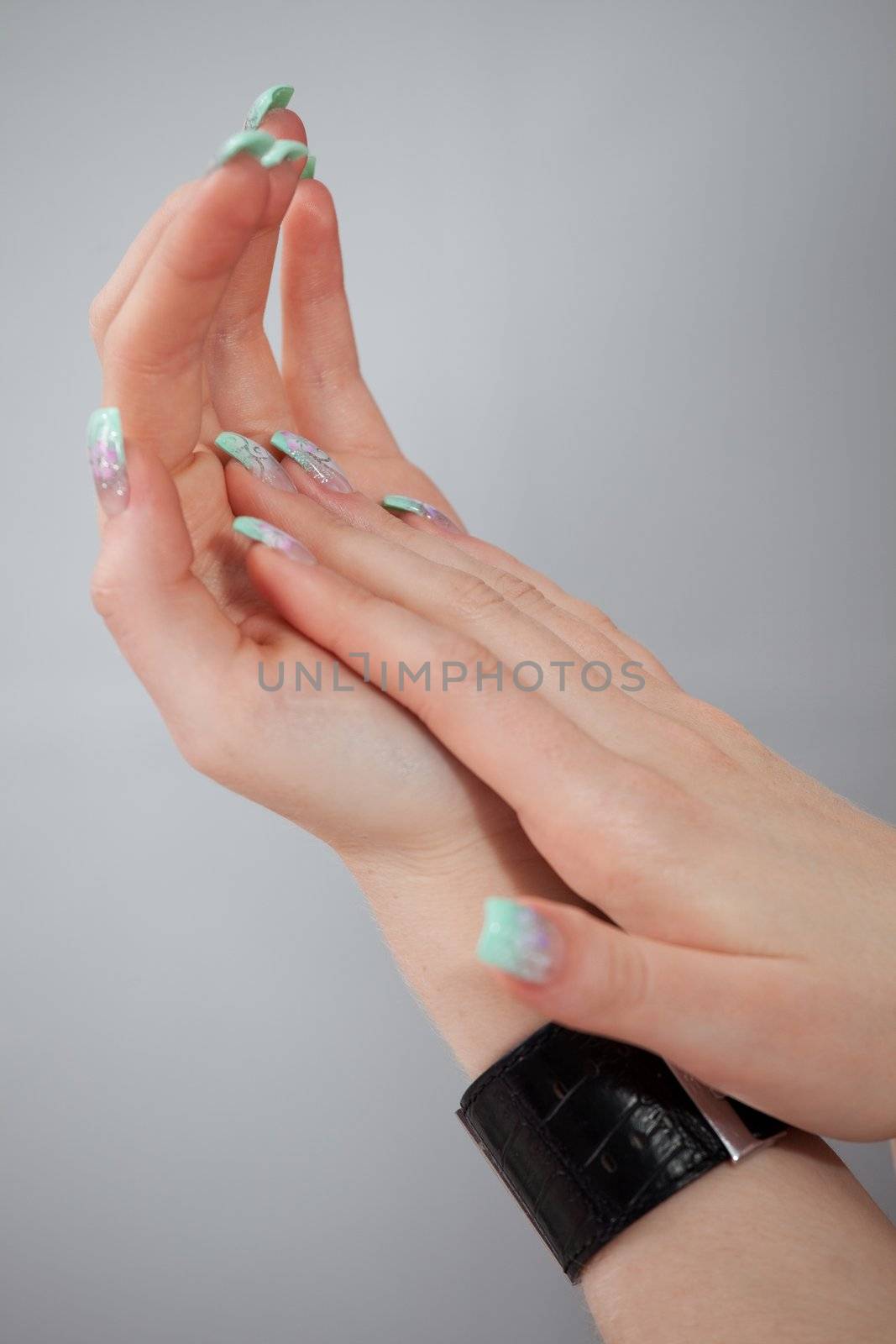 Women hands with beautiful fingernails. Close-up shot