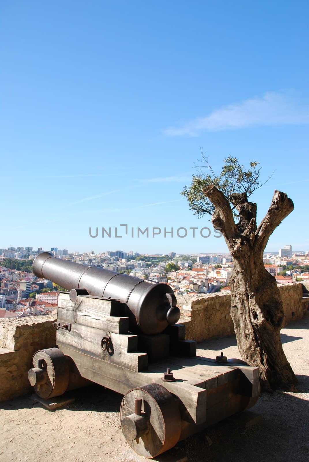 Cityscape of Lisbon in Portugal with cannon weapon by luissantos84
