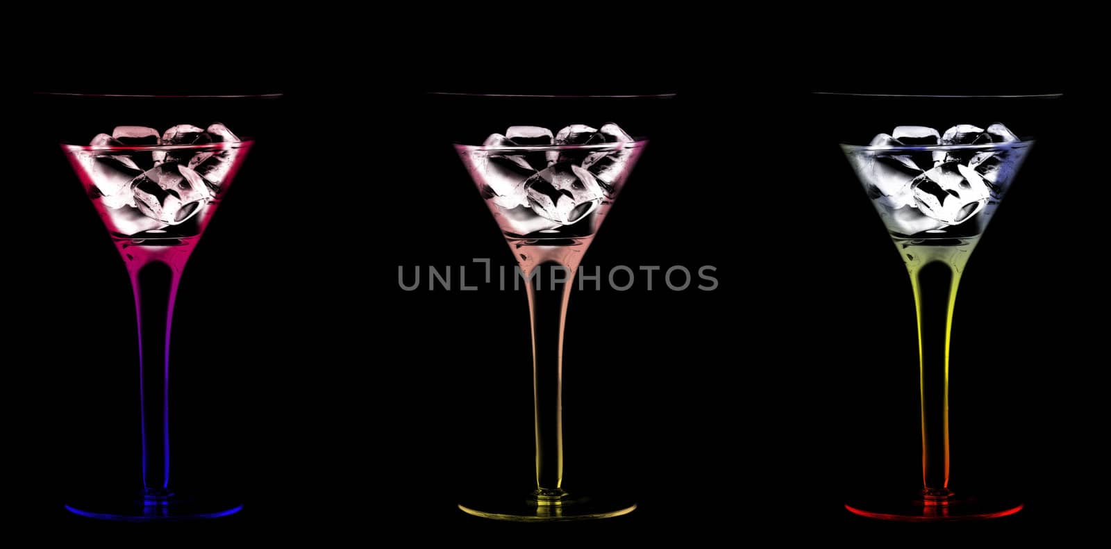 Wine Glasses with a cocktail and ice on a black background