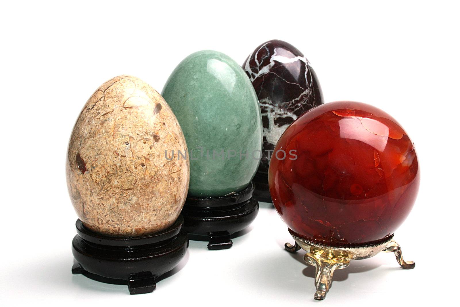 Multi-coloured stones which are used in spiritualistic and magic sessions in the form of a sphere and eggs on supports.