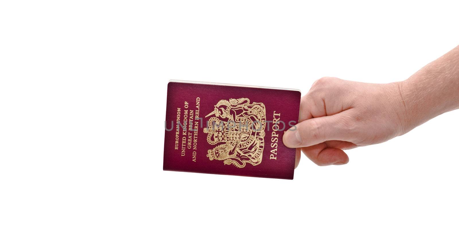an isolated over white caucasian man's hand holding a European Union British passport 