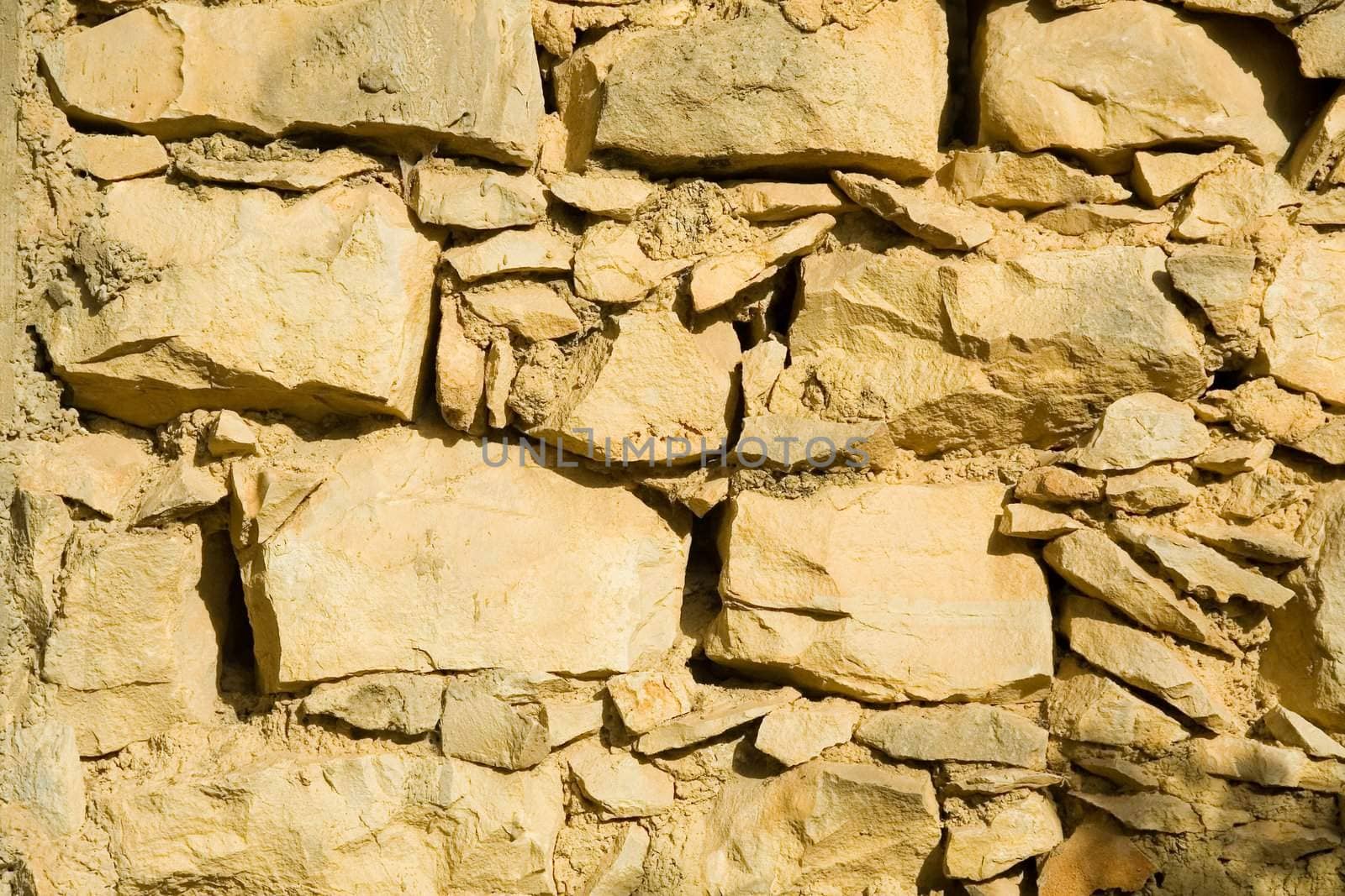Wall constructed of stone bricks. A fine textural background for graphic design