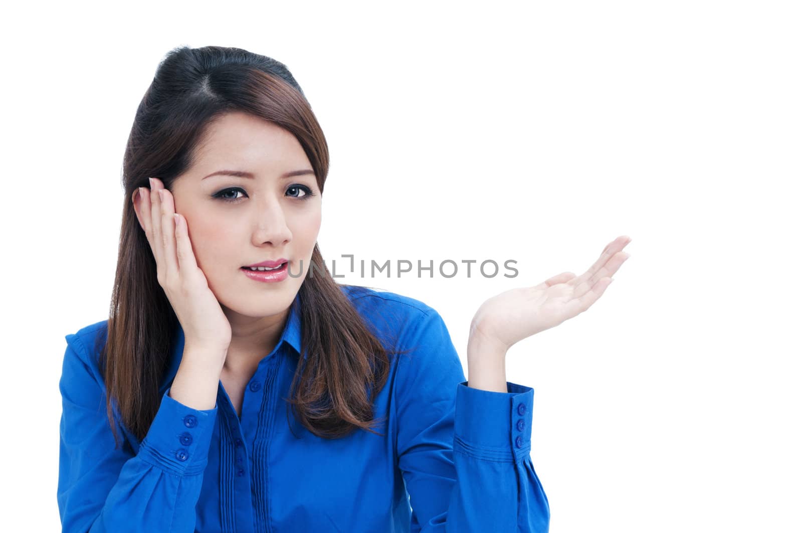 Portrait of an attractive young businesswoman presenting things with her hand over white background.