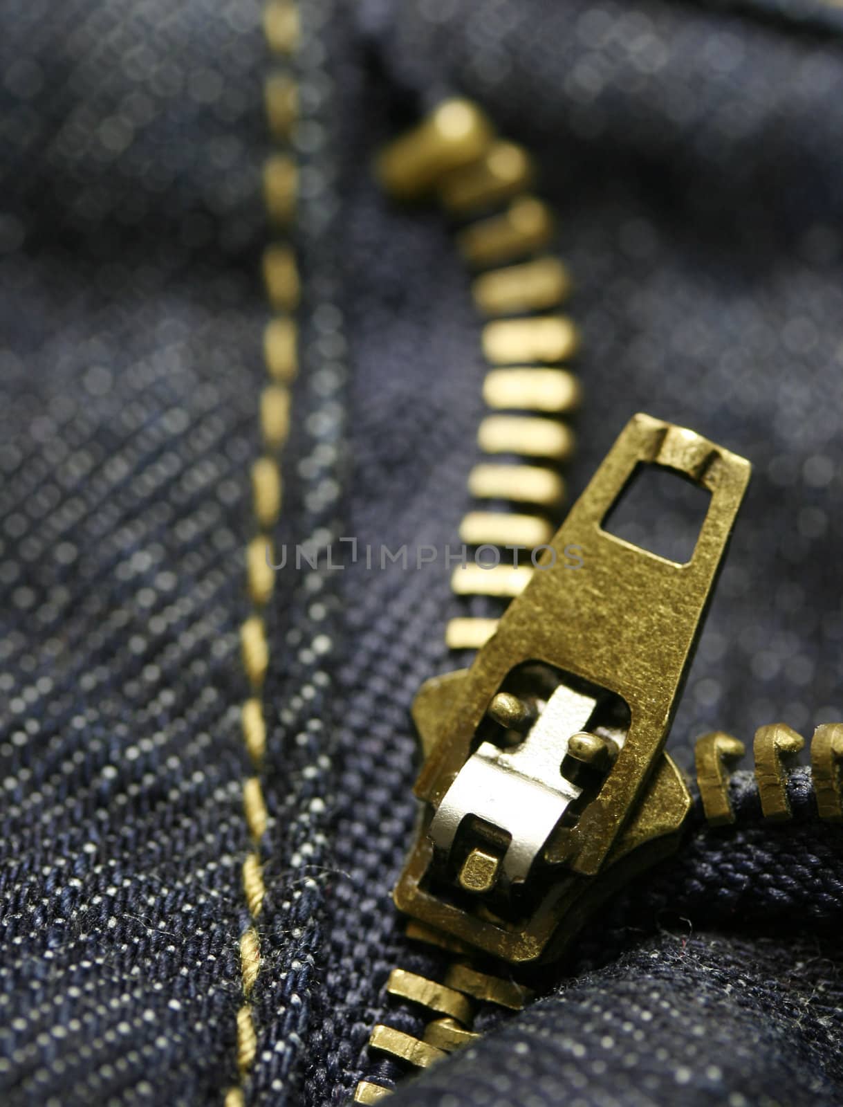 Macro shot of a zipper from blue jeans.