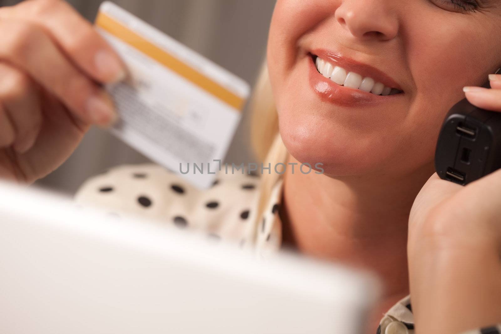 Beautiful Woman on Phone Holding Credit Card by Feverpitched