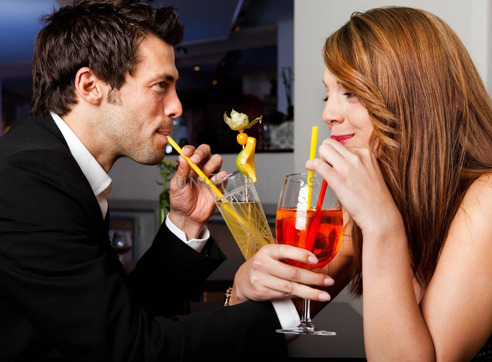 Young cheerful couple having good time together