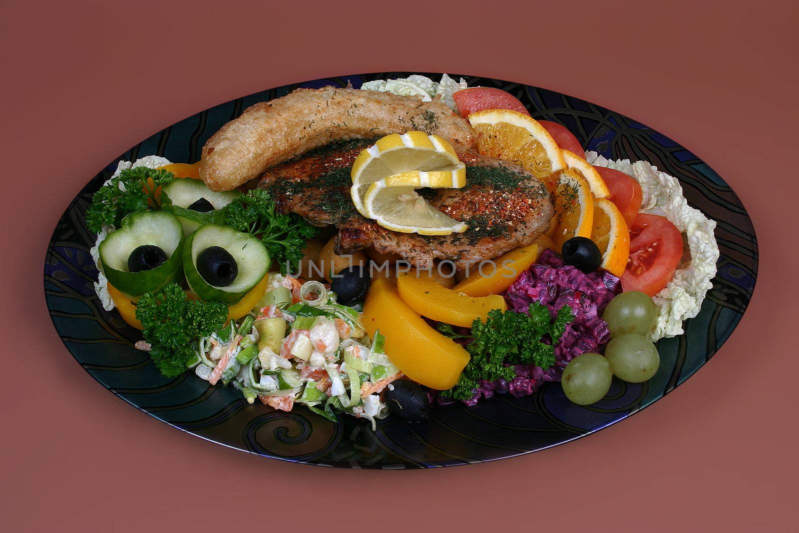 Big portion with roasted steak, sausage and miscellaneous vegetables