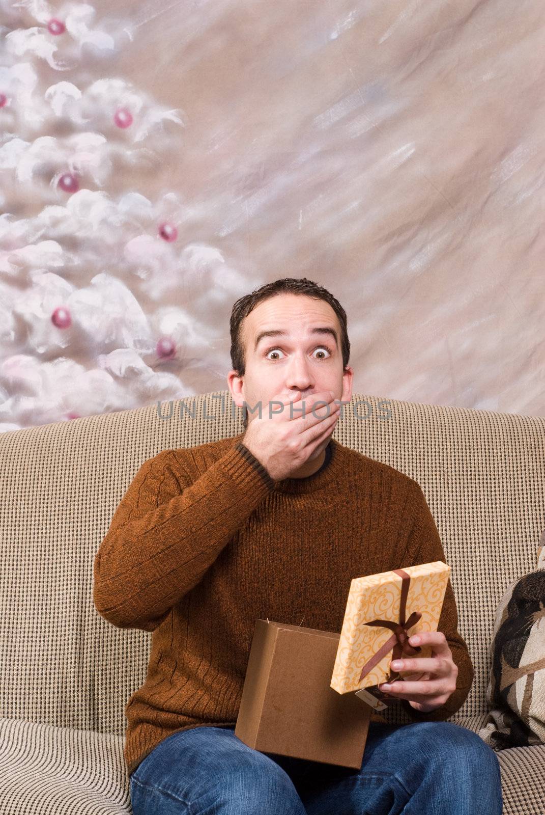 A young man is happy for receiving his xmas present