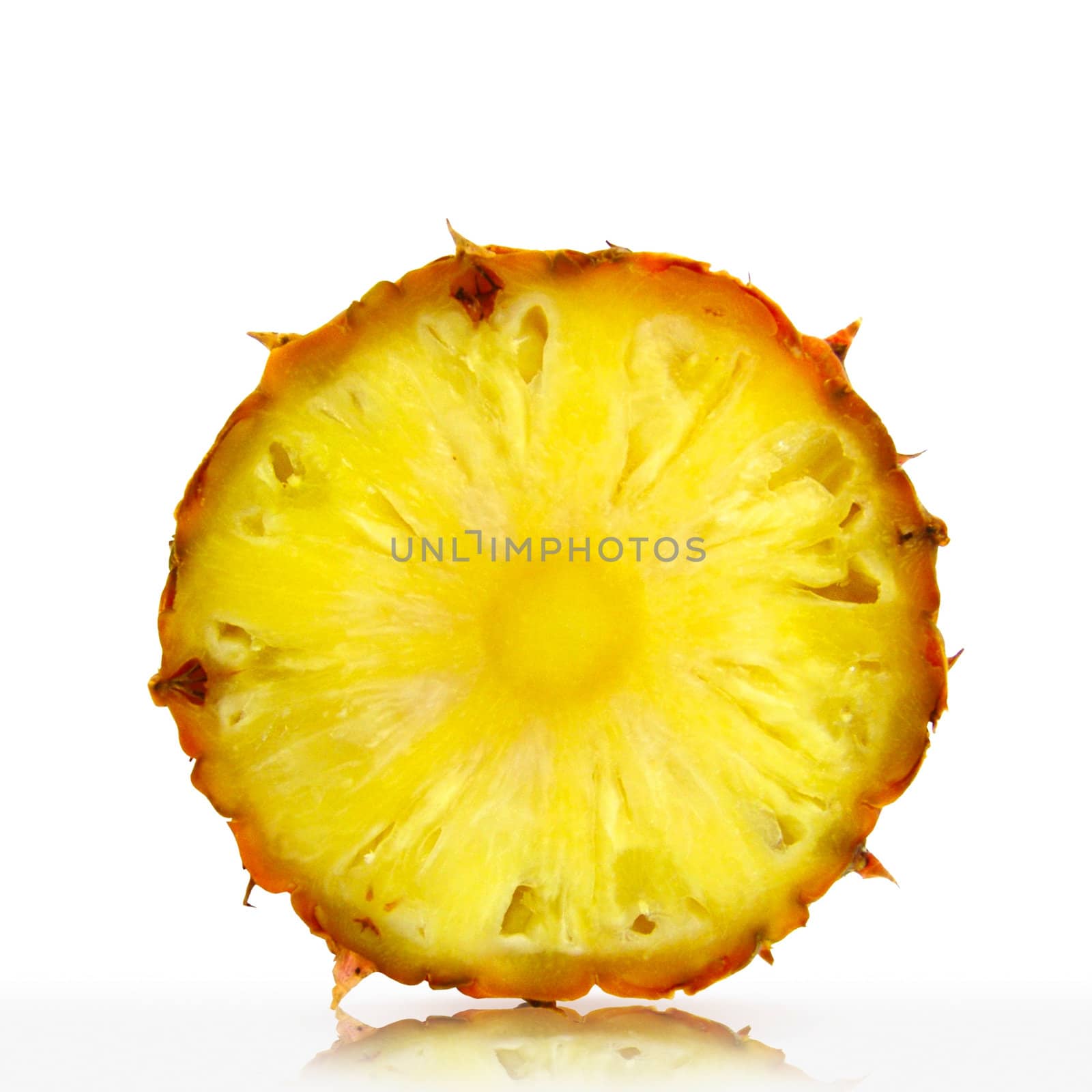 Slice of pineapple on a white background                           