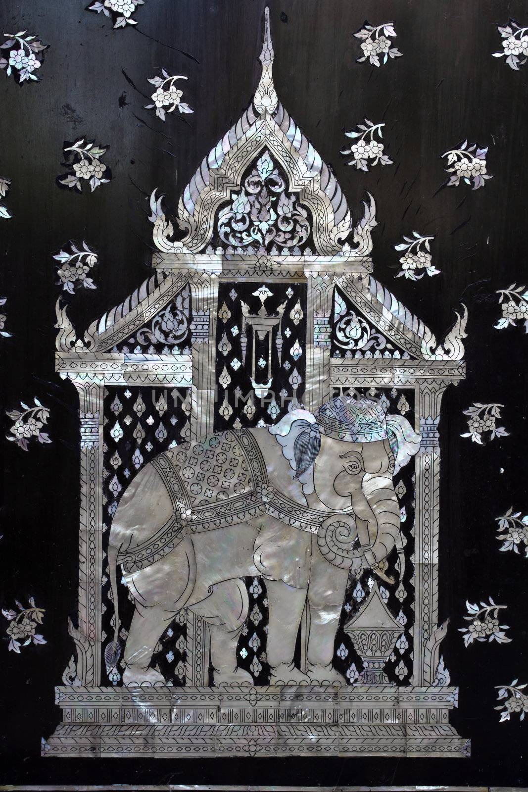 Traditional Thai style church door art, decorated with pieces oyster shell