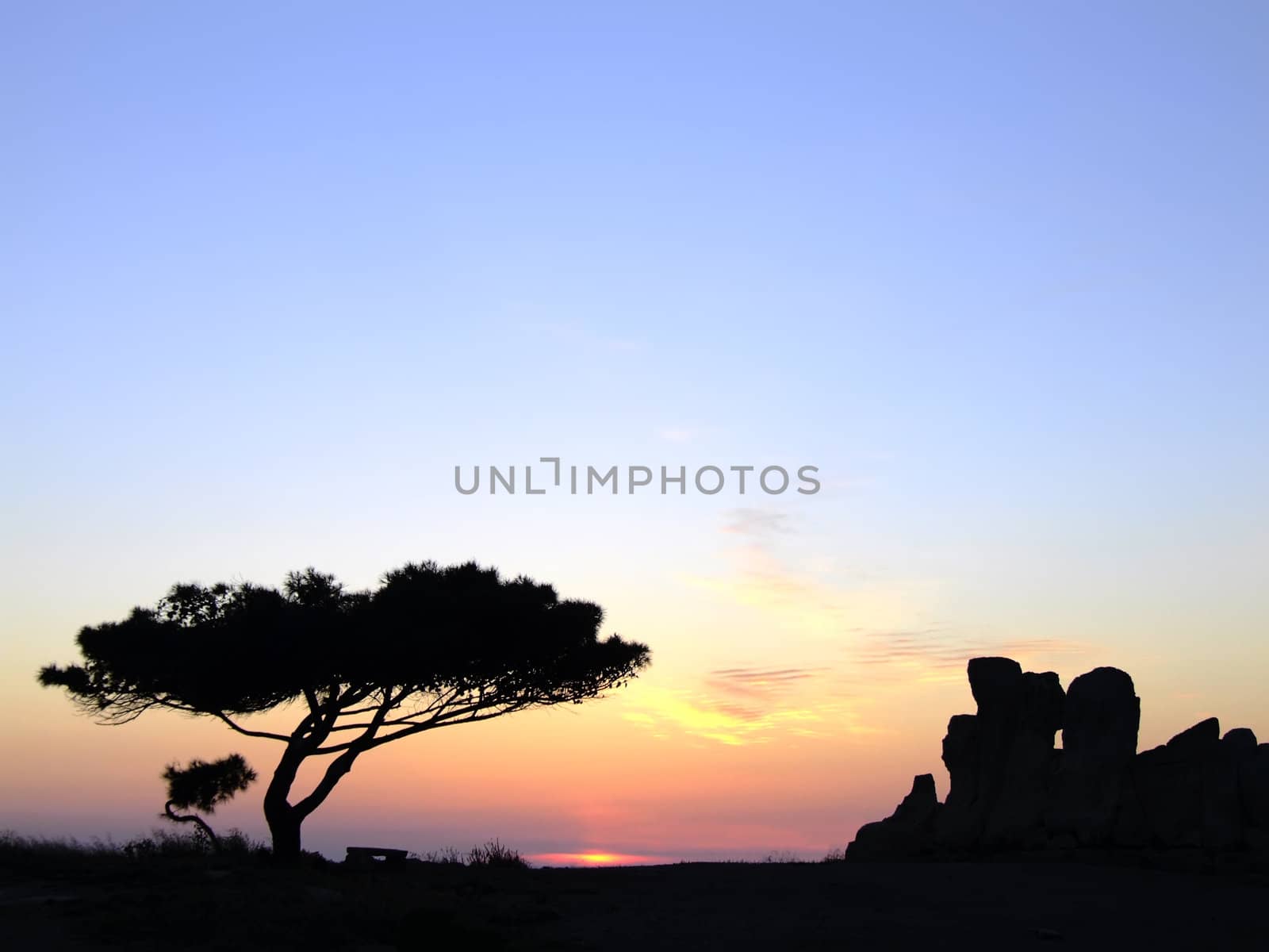 The oldest free-standing building/temple in the world. Oldest neolithic prehistoric temple built thousands of years before the pyramids. - Hagar Qim & Mnajdra Temples in Malta, Mediterranean Sea, Europe - here seen silhouetted at sunset