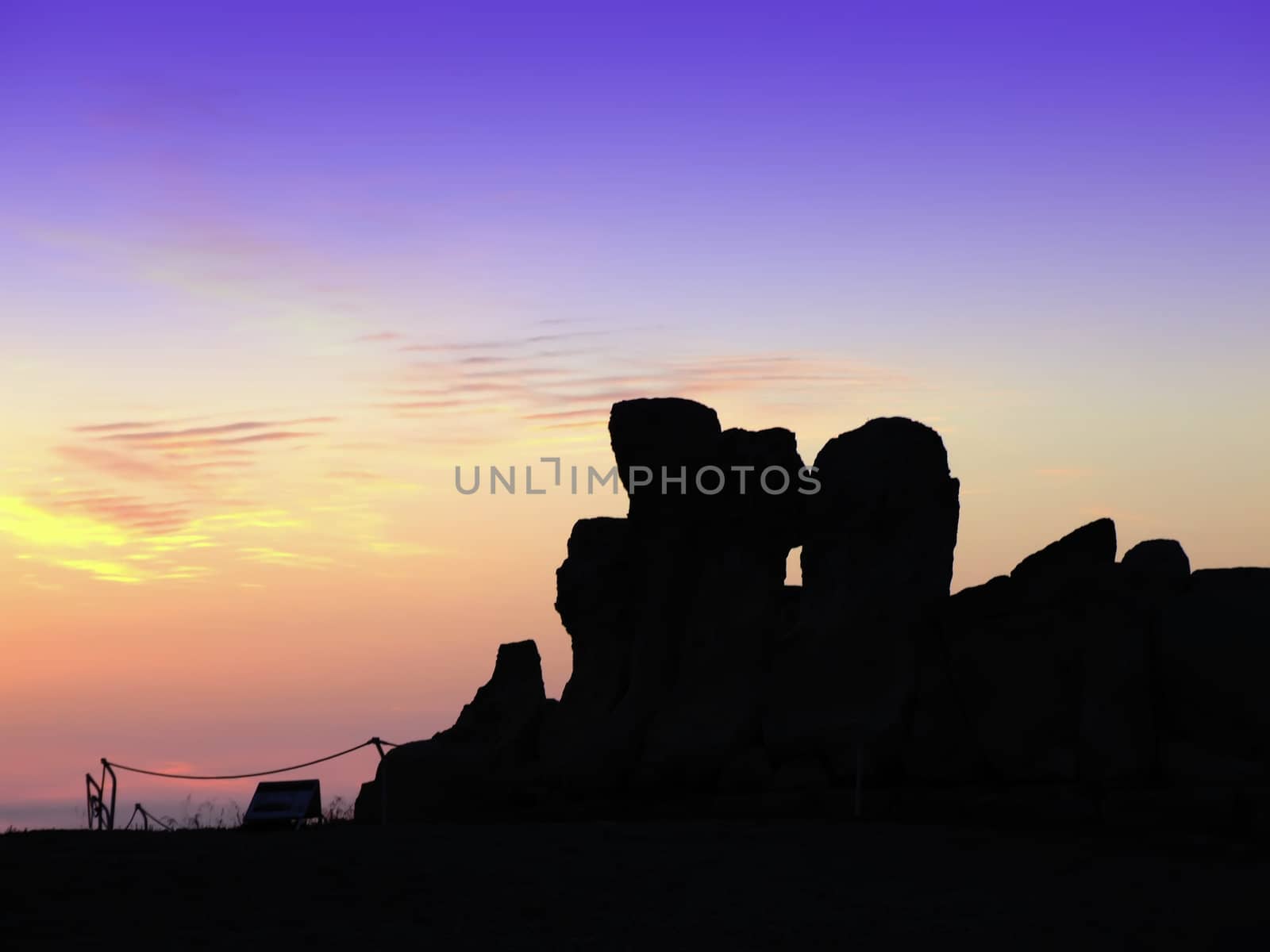 The oldest free-standing building/temple in the world. Oldest neolithic prehistoric temple built thousands of years before the pyramids. - Hagar Qim & Mnajdra Temples in Malta, Mediterranean Sea, Europe - here seen silhouetted at sunset