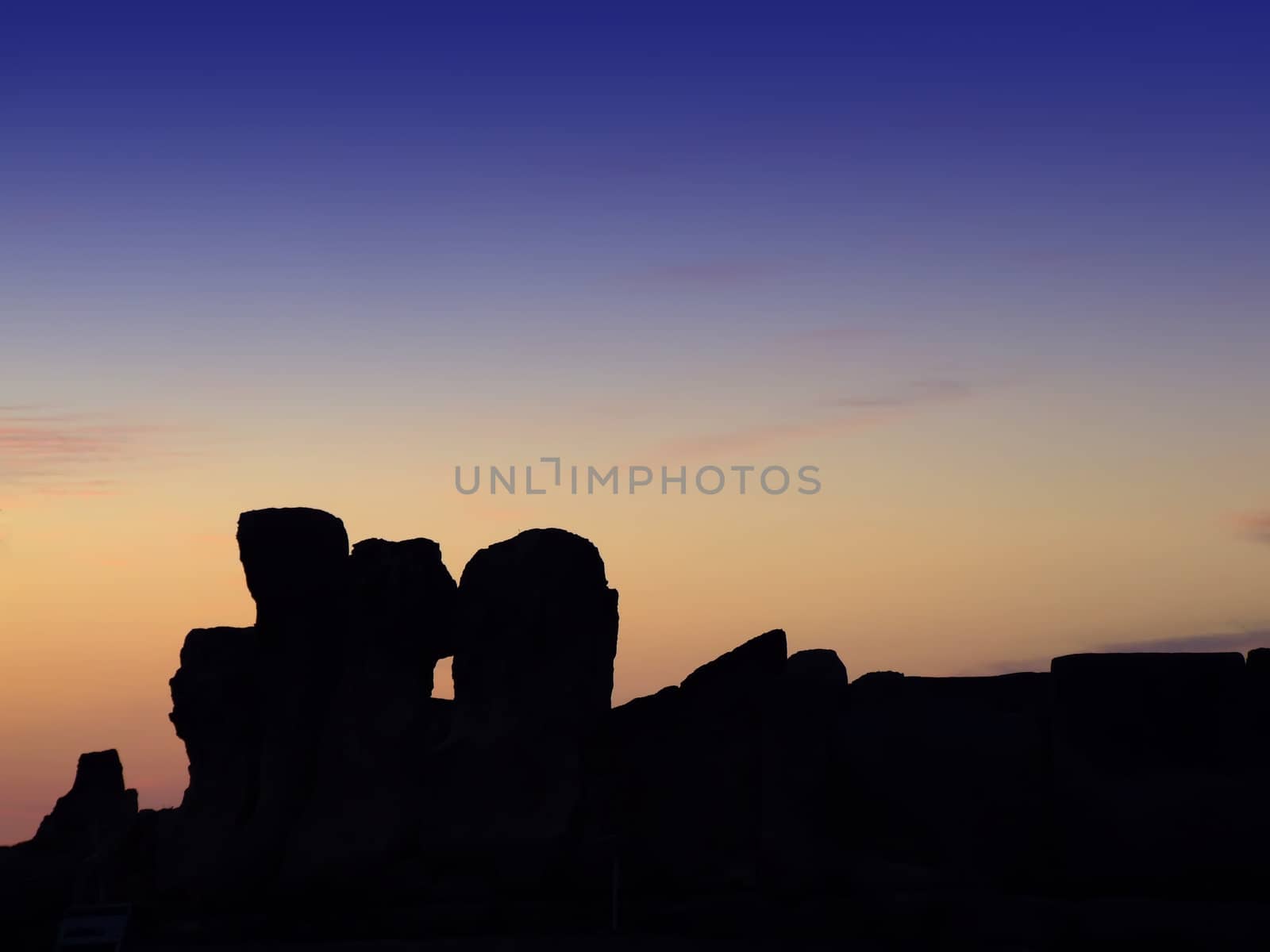 The oldest free-standing building/temple in the world. Oldest neolithic prehistoric temple built thousands of years before the pyramids. - Hagar Qim & Mnajdra Temples in Malta, Mediterranean Sea, Europe - here seen silhouetted at sunset