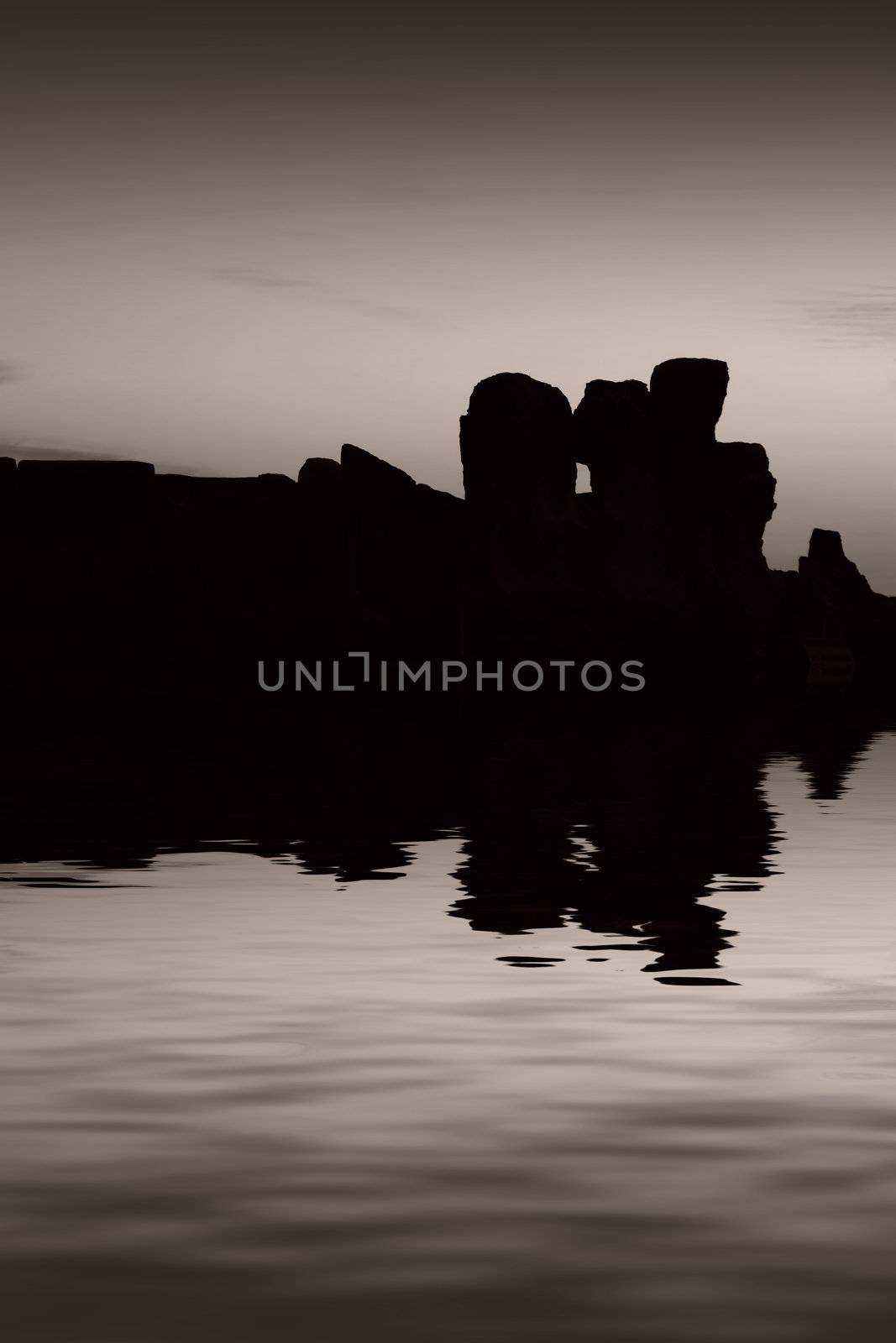 The oldest free-standing building/temple in the world. Oldest neolithic prehistoric temple built thousands of years before the pyramids. - Hagar Qim & Mnajdra Temples in Malta, Mediterranean Sea, Europe - here seen silhouetted at sunset