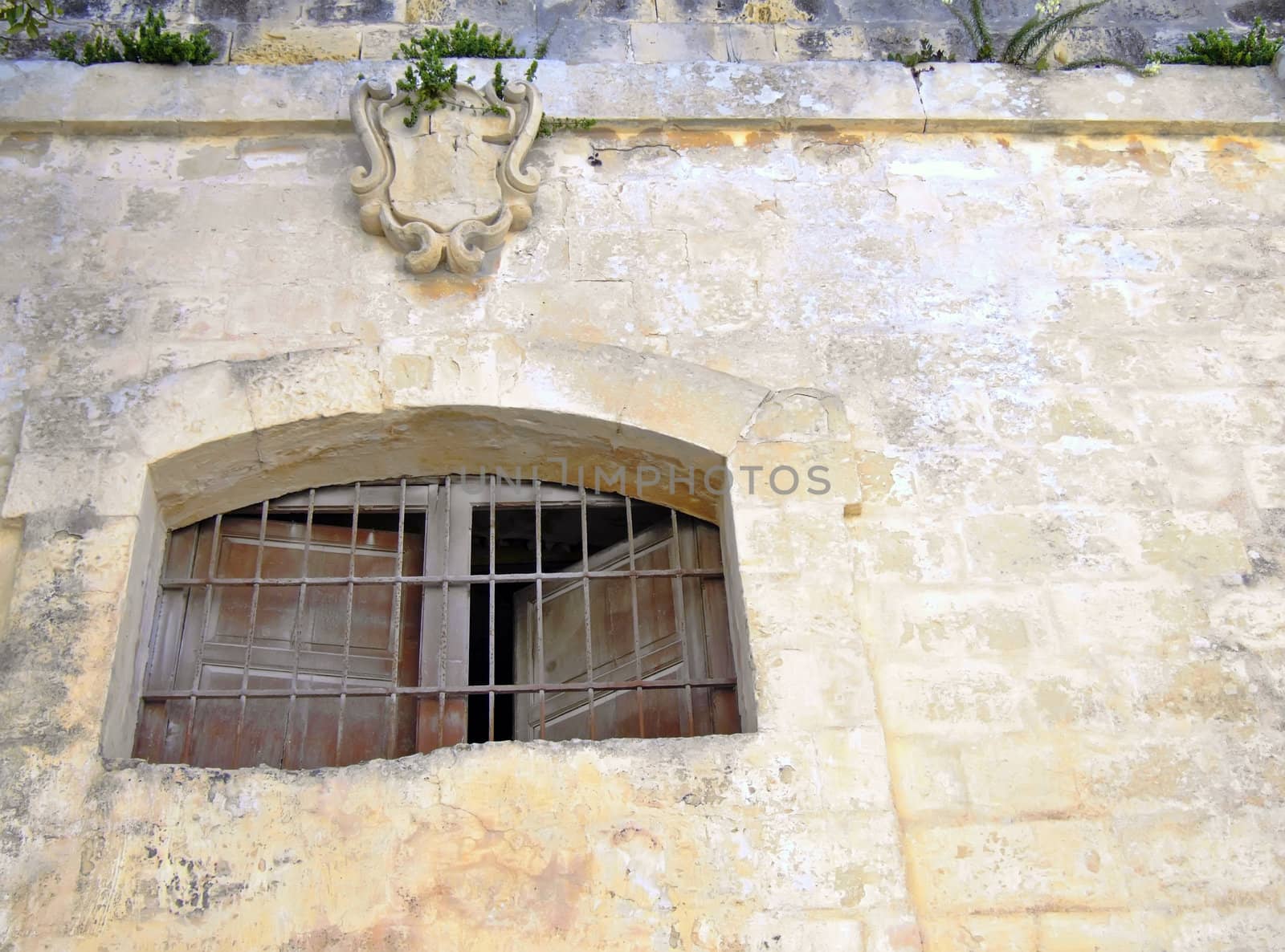 Medieval prison window in the old city of Mdina, Malta