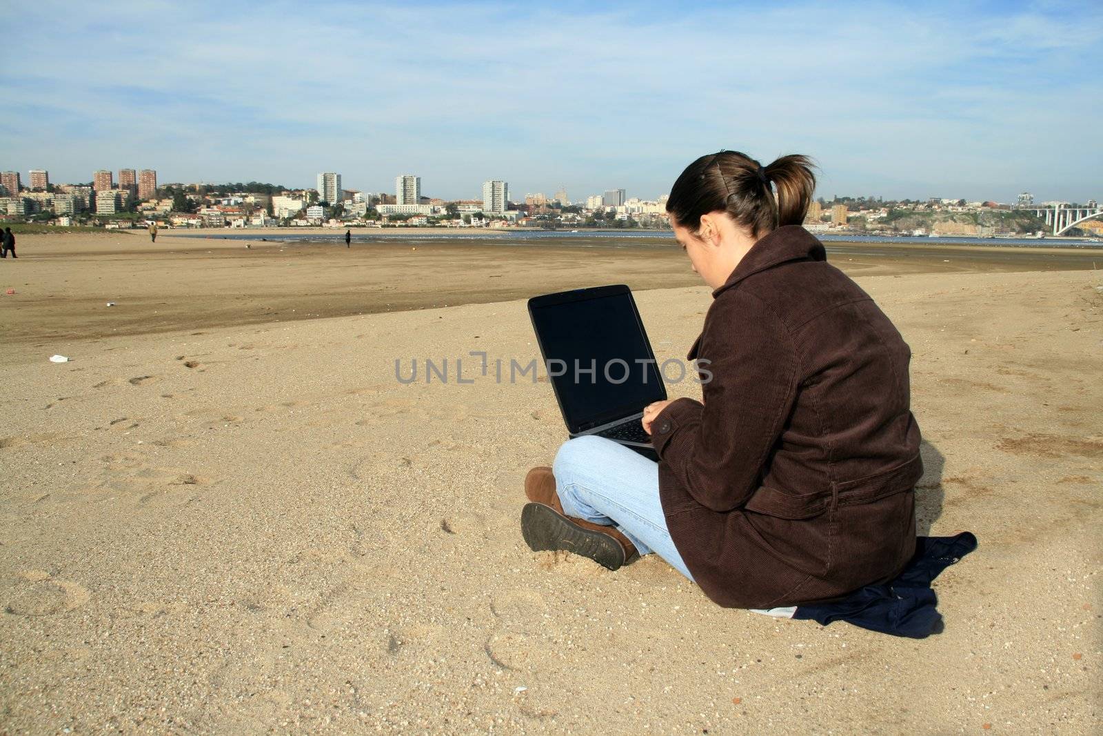 casual woman working on the beach