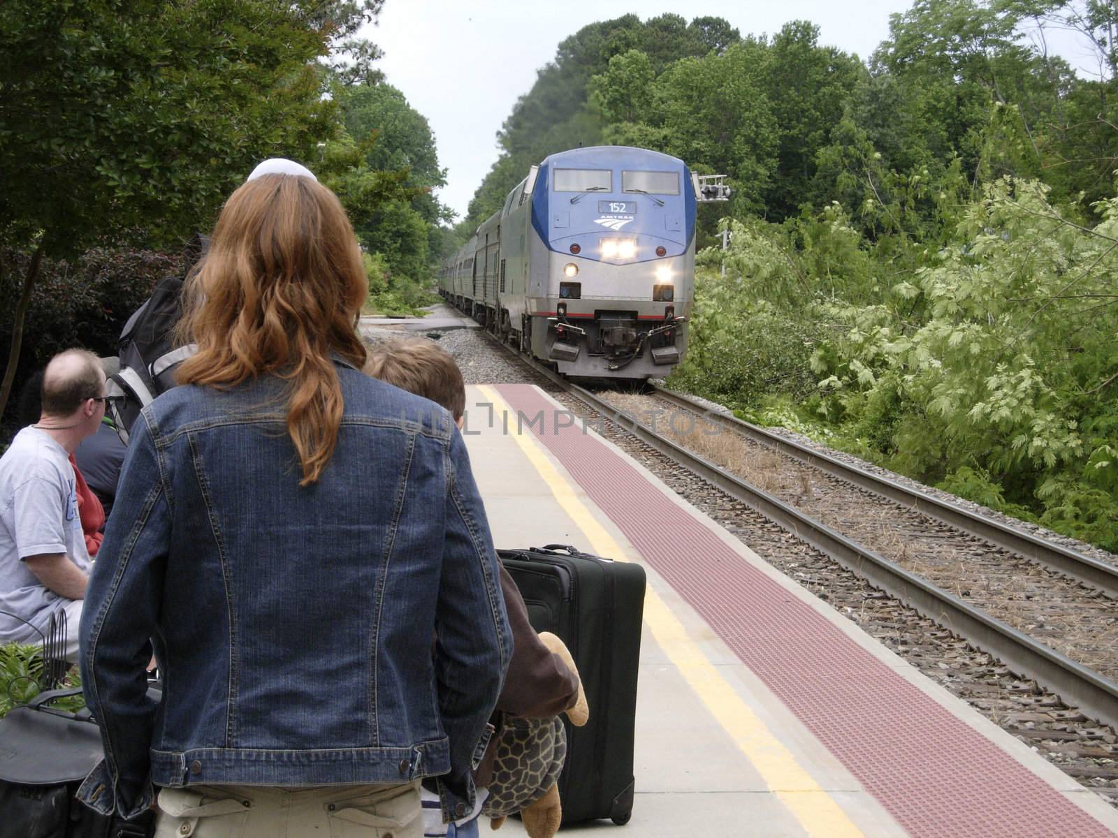 Waiting for the arriving Amtrak train at the Cary, NC train station on Saturday, May 24. Increased usage of the still reasonably priced train may be a result of the high cost of driving.