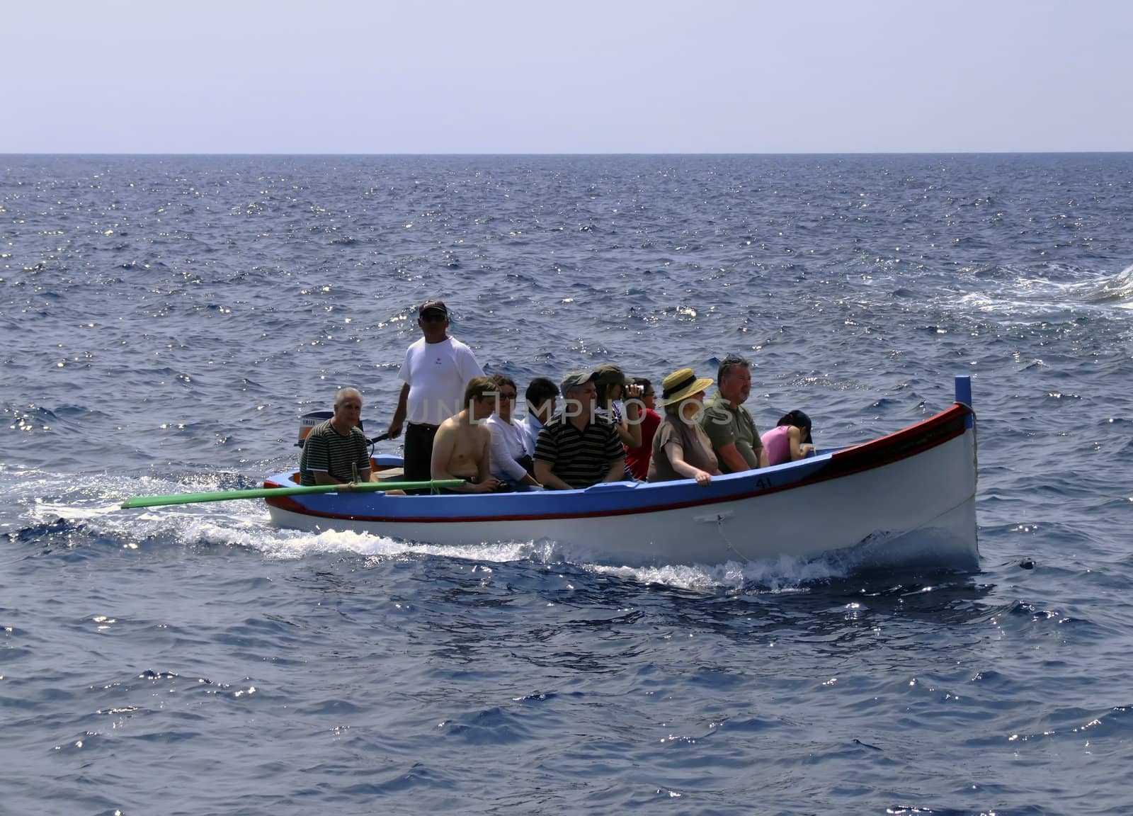 Group of tourists on leisure boat in Malta