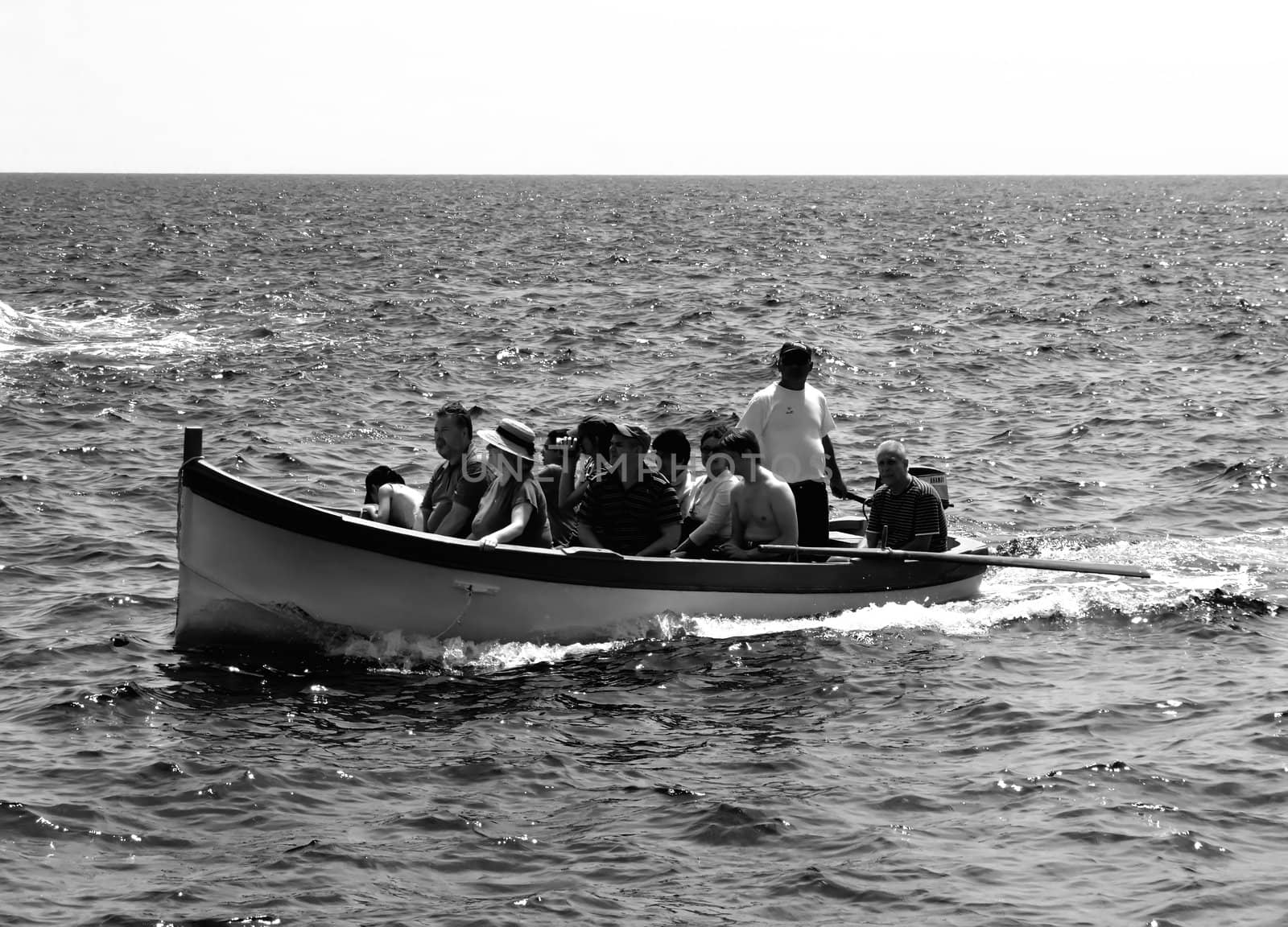 Group of tourists on leisure boat in Malta